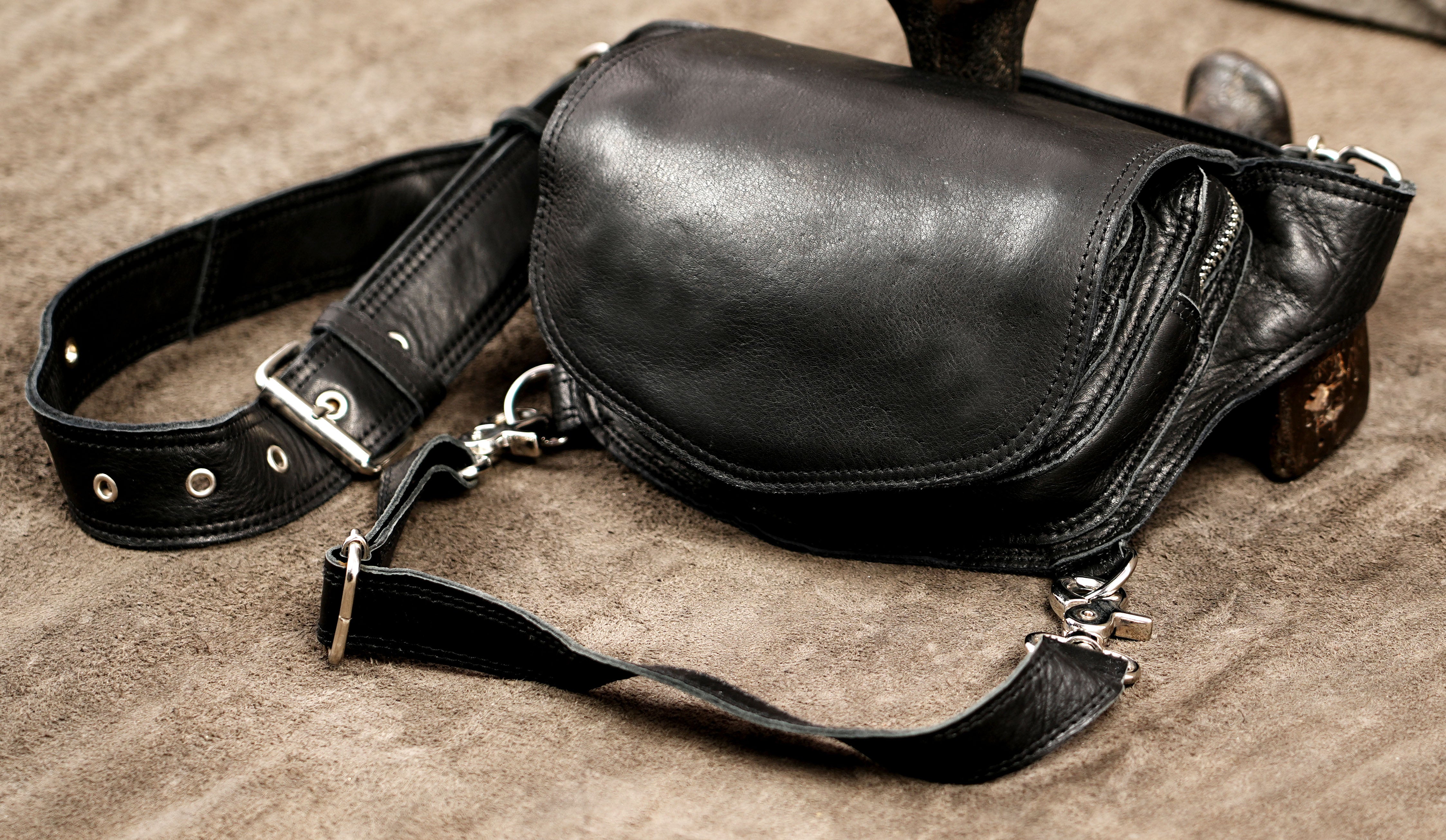 Cool and practical leather utility leg bag favored by travelers and alternative fashion lovers worldwide