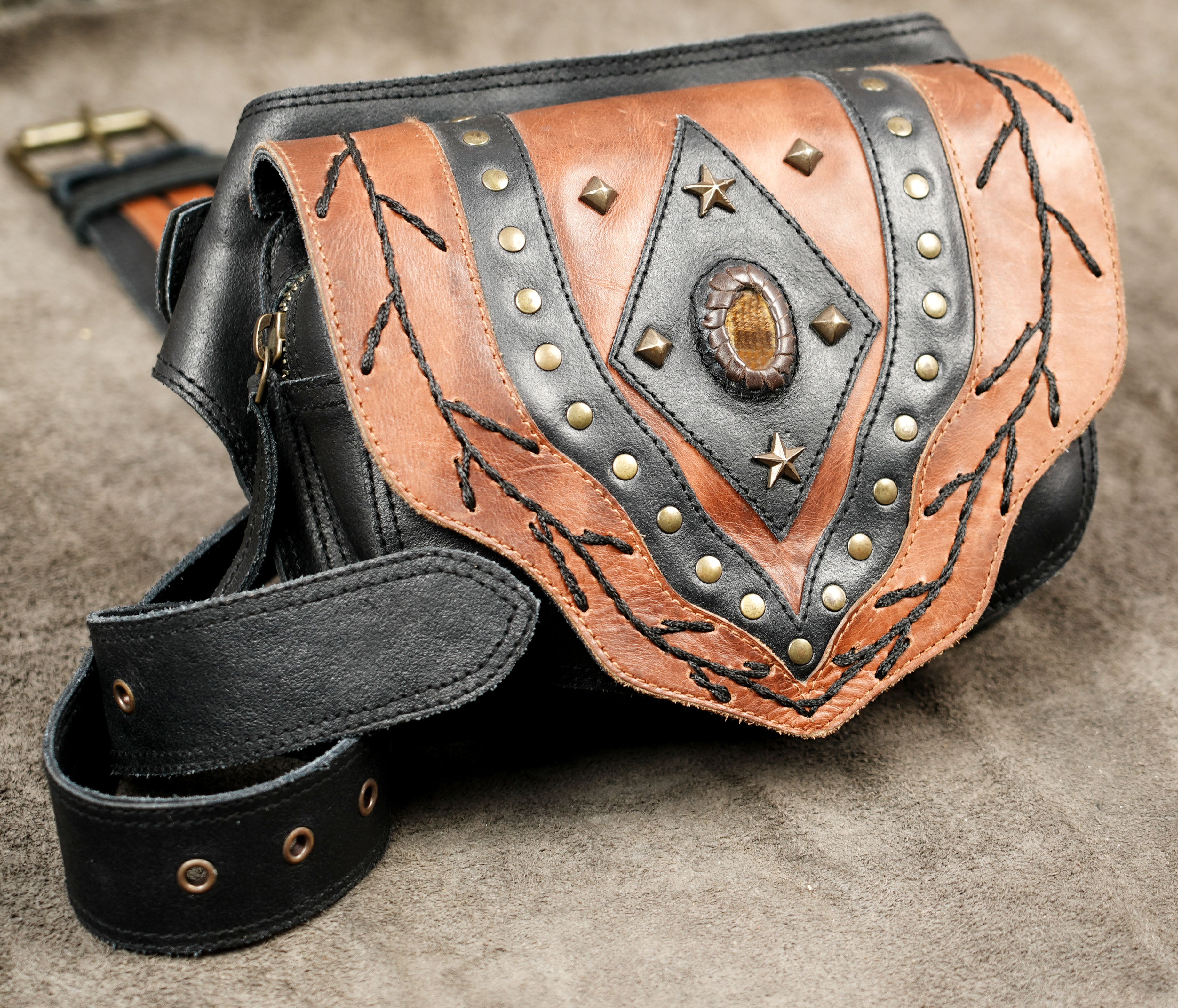 Two-tone leather fanny pack with braided stitch detailing