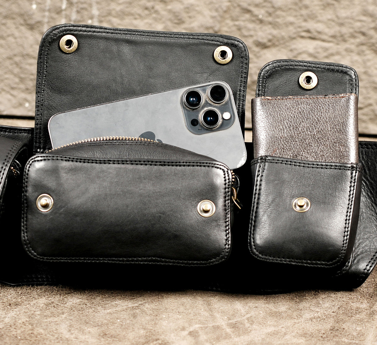 Black leather belt with detachable-look cargo storage compartments