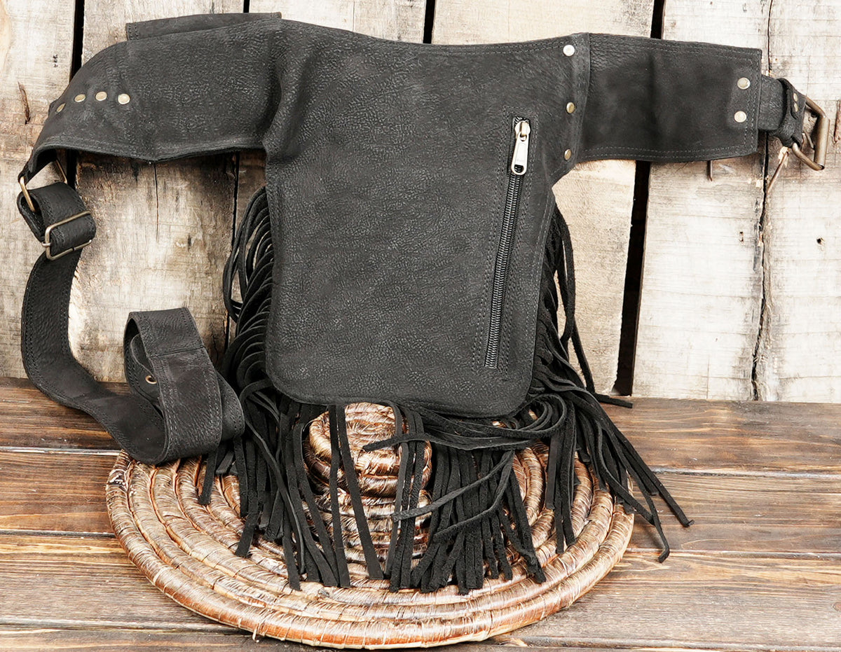 Adjustable black leather festival hip pouch with tassels