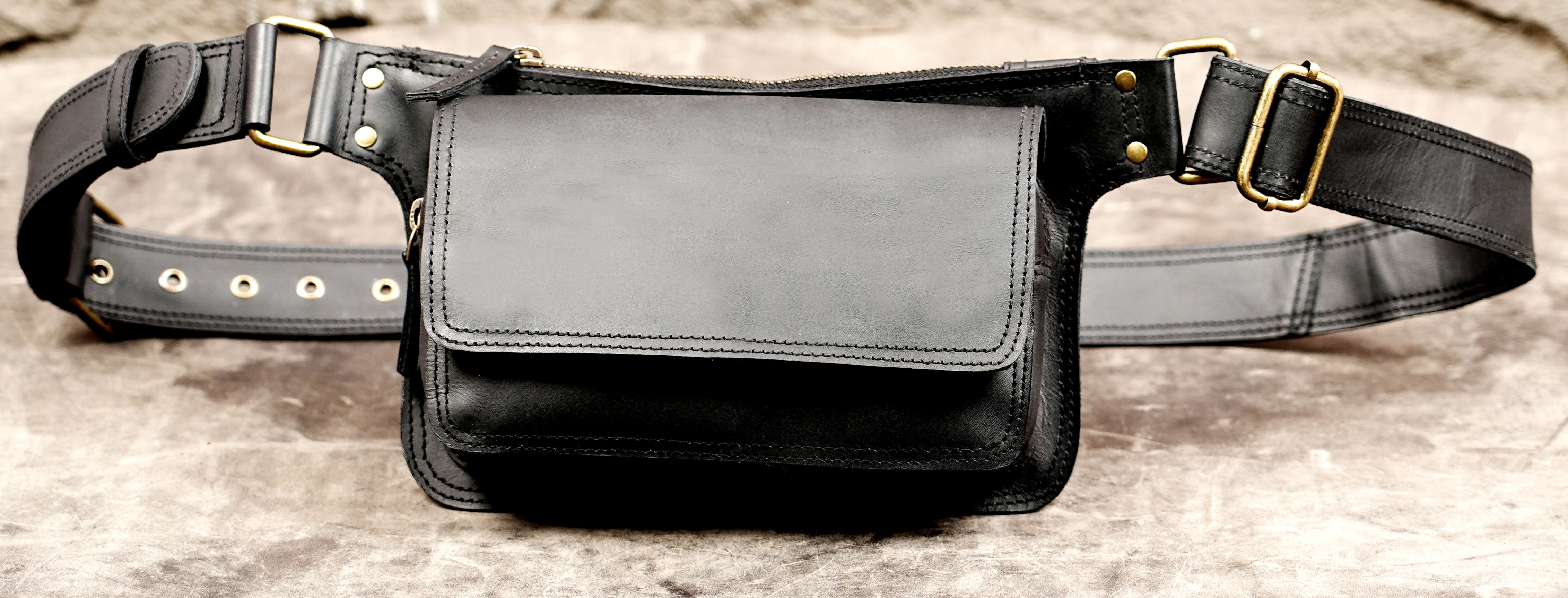 Black leather waist pouch with vintage antique brass details