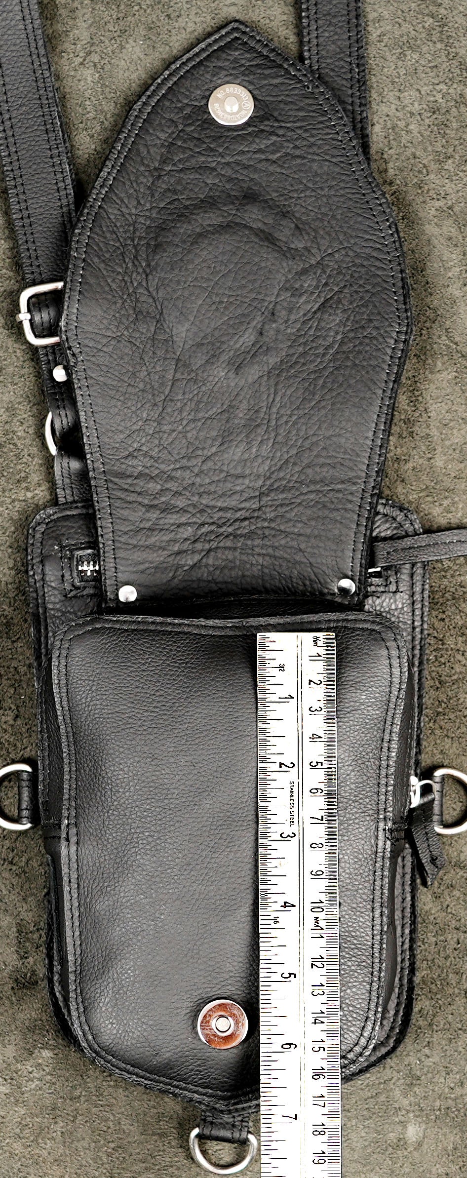 Nomad style black leather holster with fringed yoke and stone accents