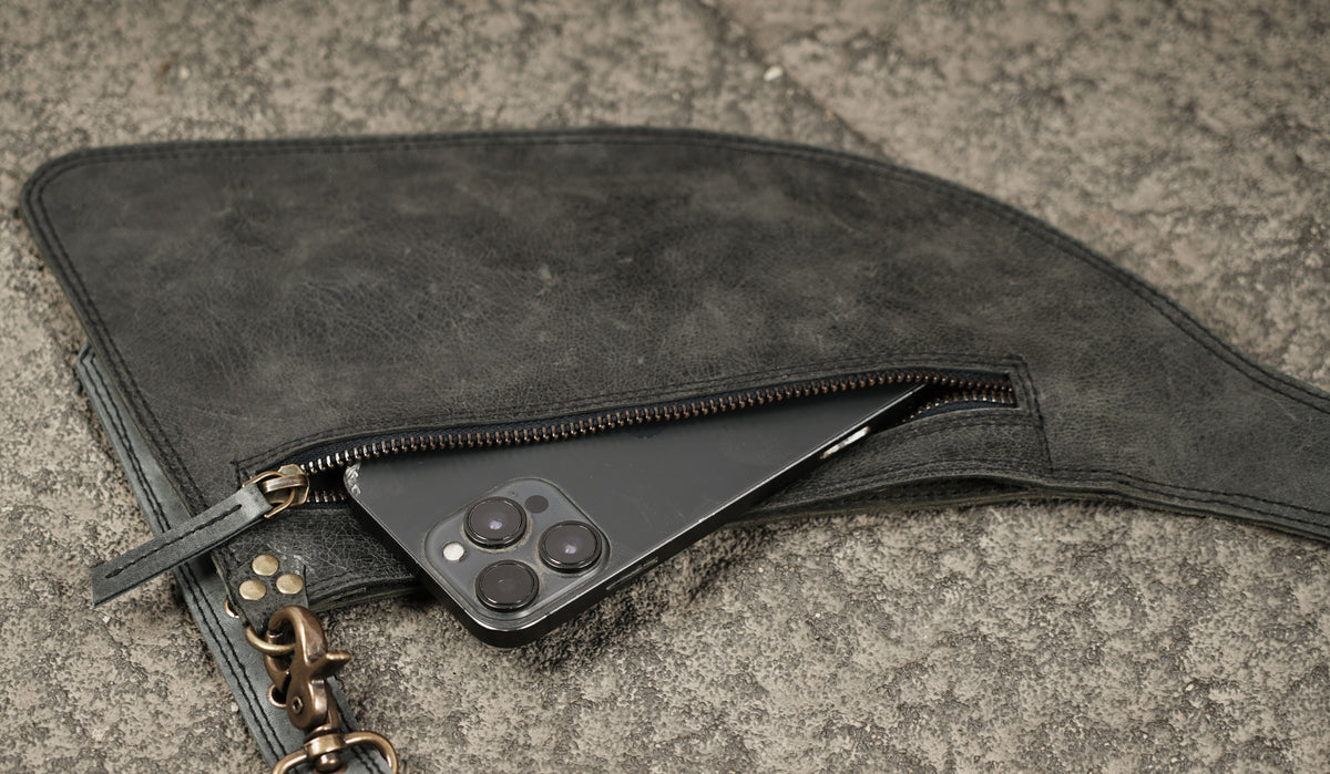 Adjustable leather shoulder holster with waist belt and zipper pockets