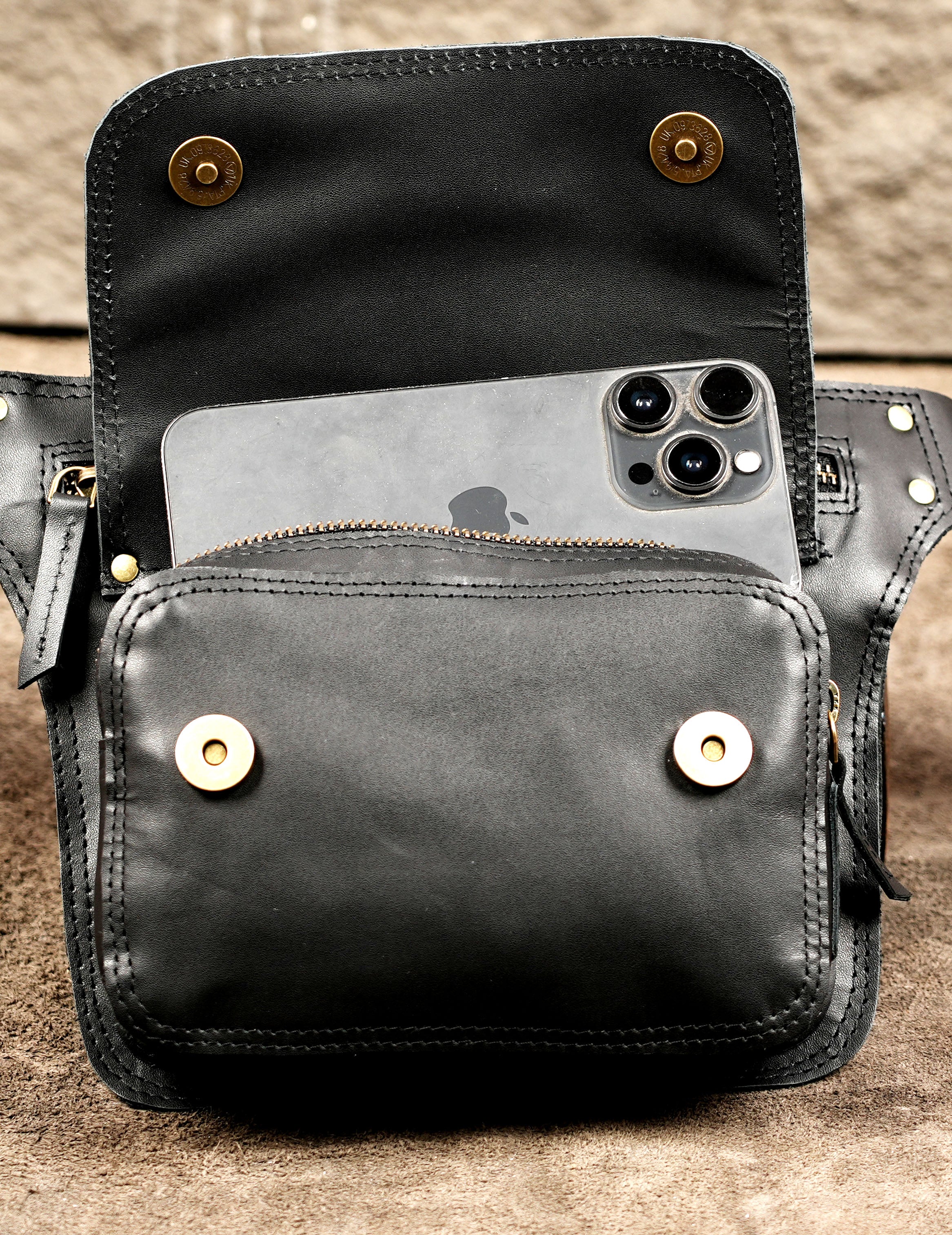 Adjustable black hip bag with zipper and front flap pocket