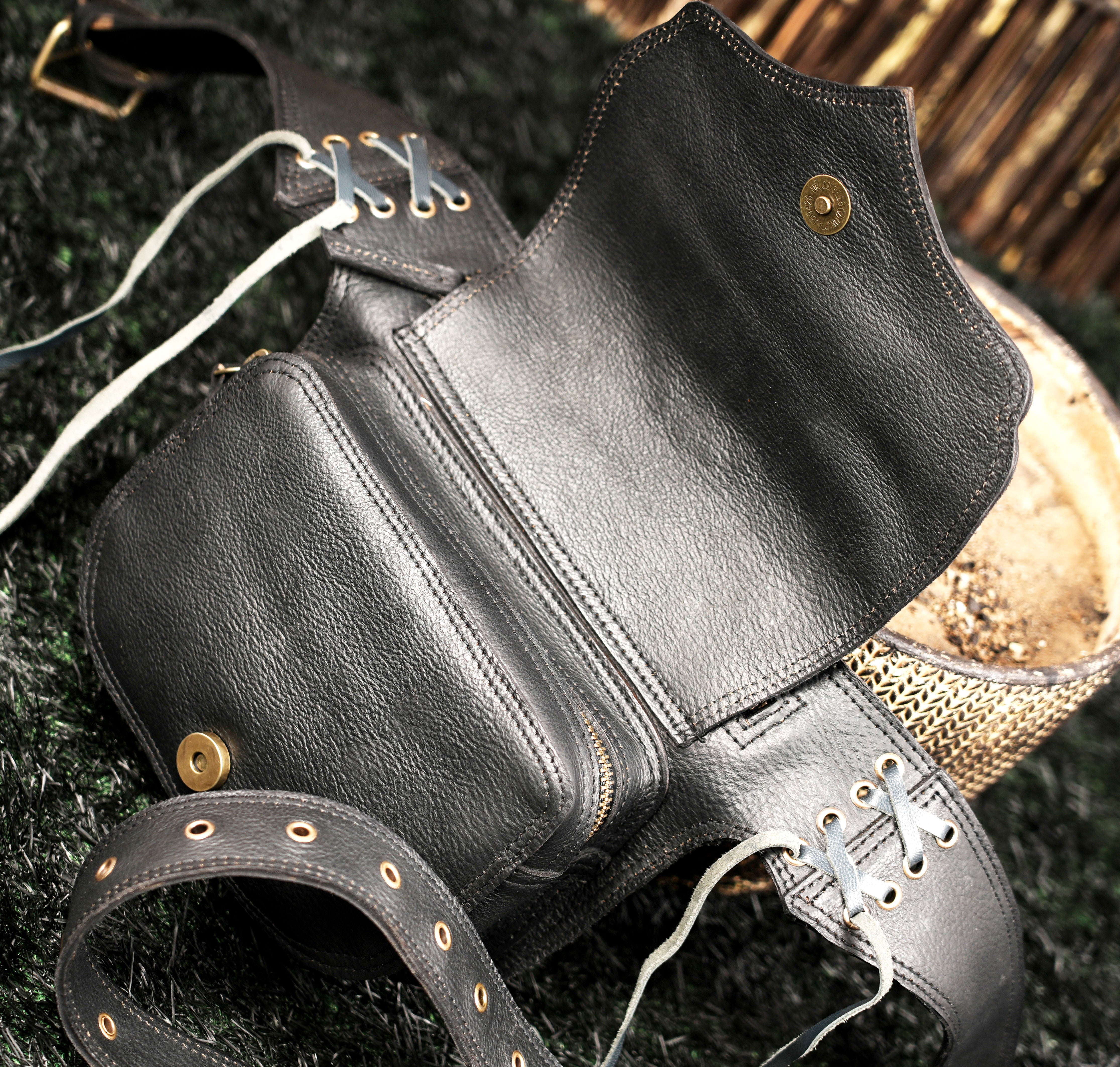 Handmade black leather pocket belt with labradorite stone and antique brass hardware details.