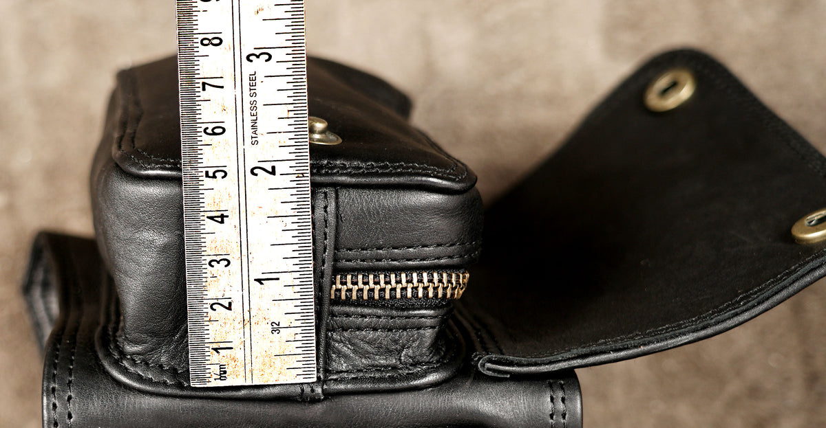 Adjustable black leather waist belt with attached utility pockets
