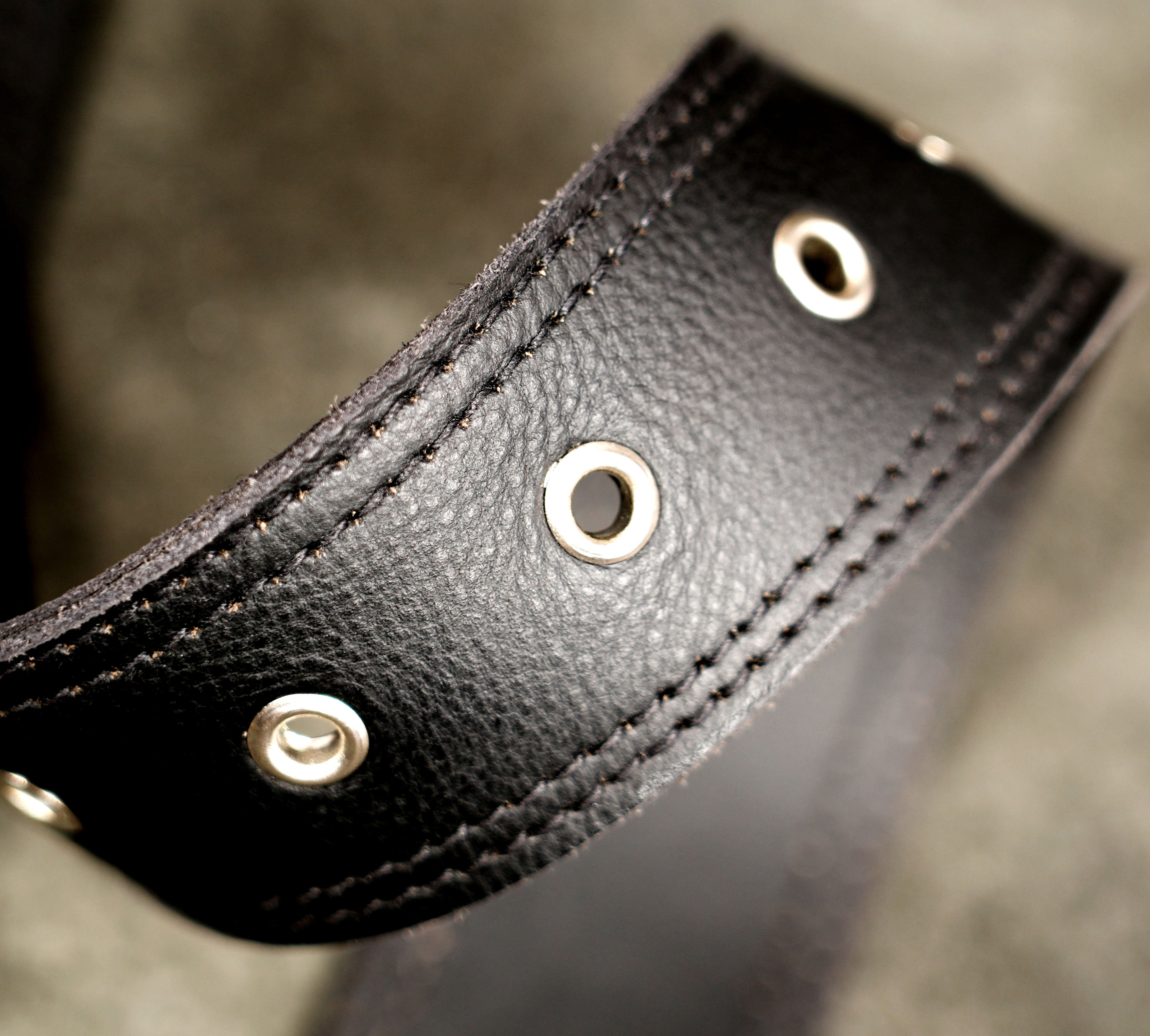 Tactical style black leather drop leg holster bag for alternative fashion.