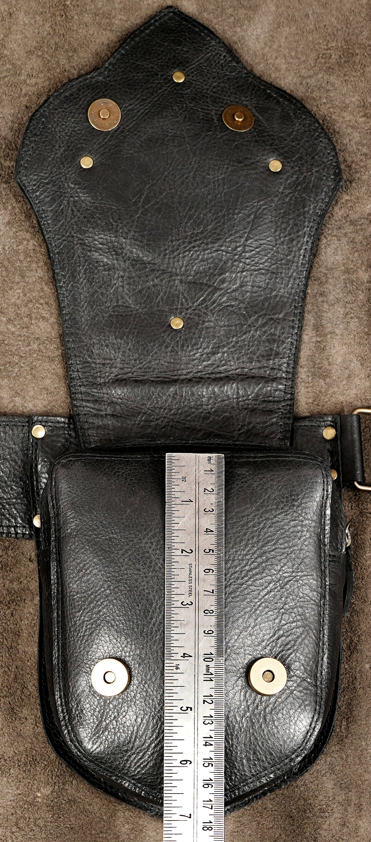 Rustic black leather belt bag with natural stone design
