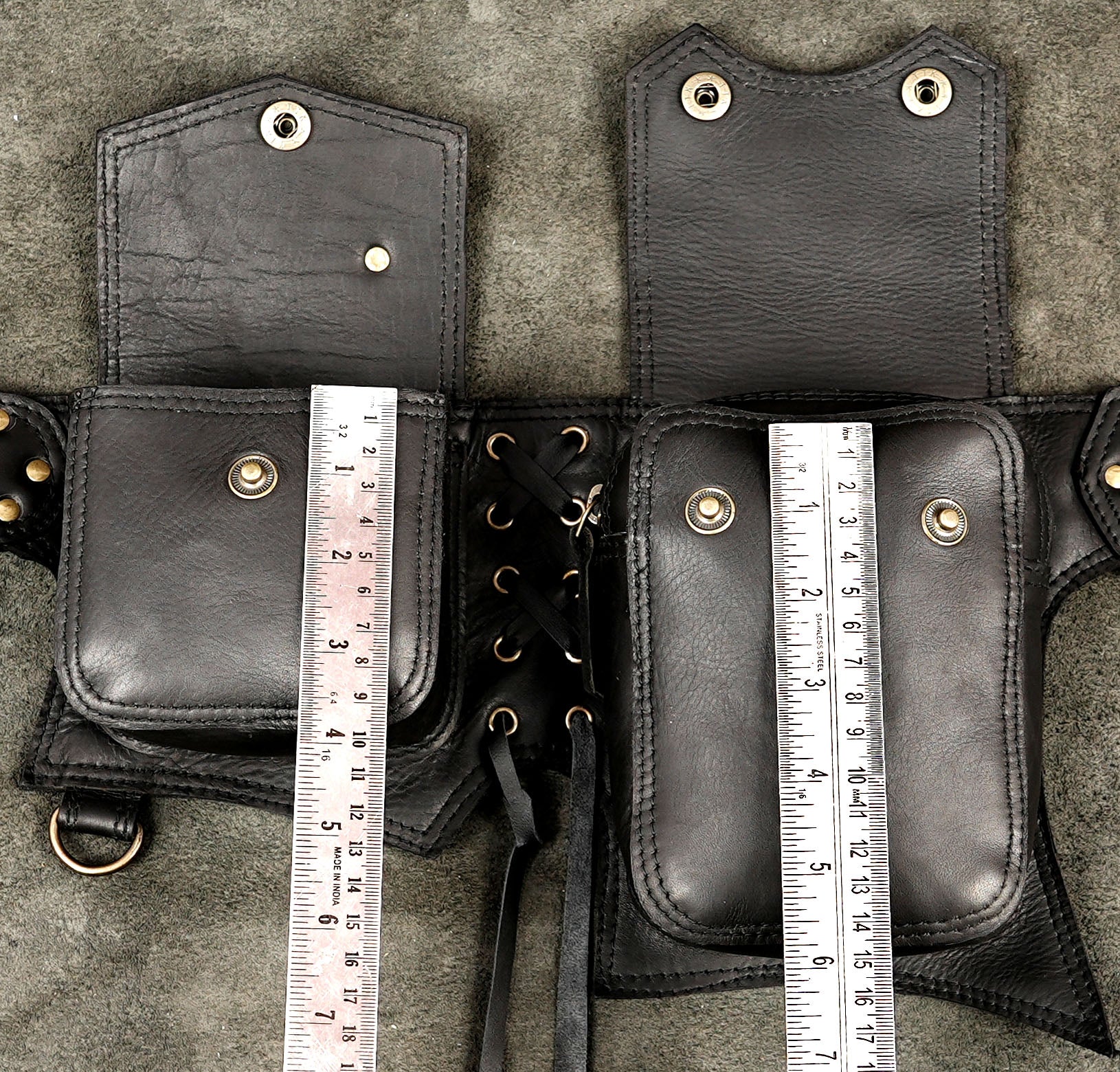 Leather belt bag worn on model showing pocket and buckle detail