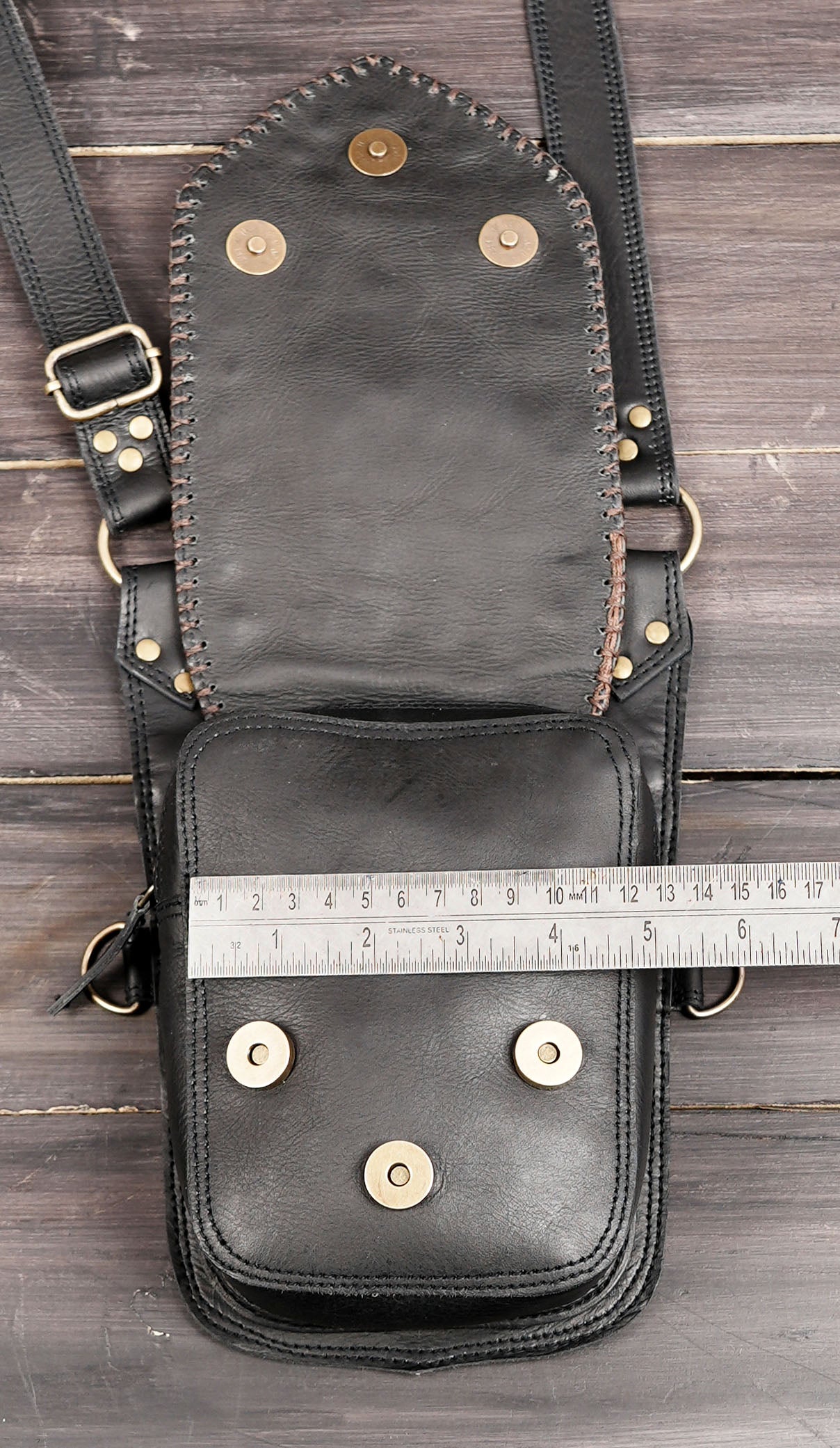 leather holster with metal hardware