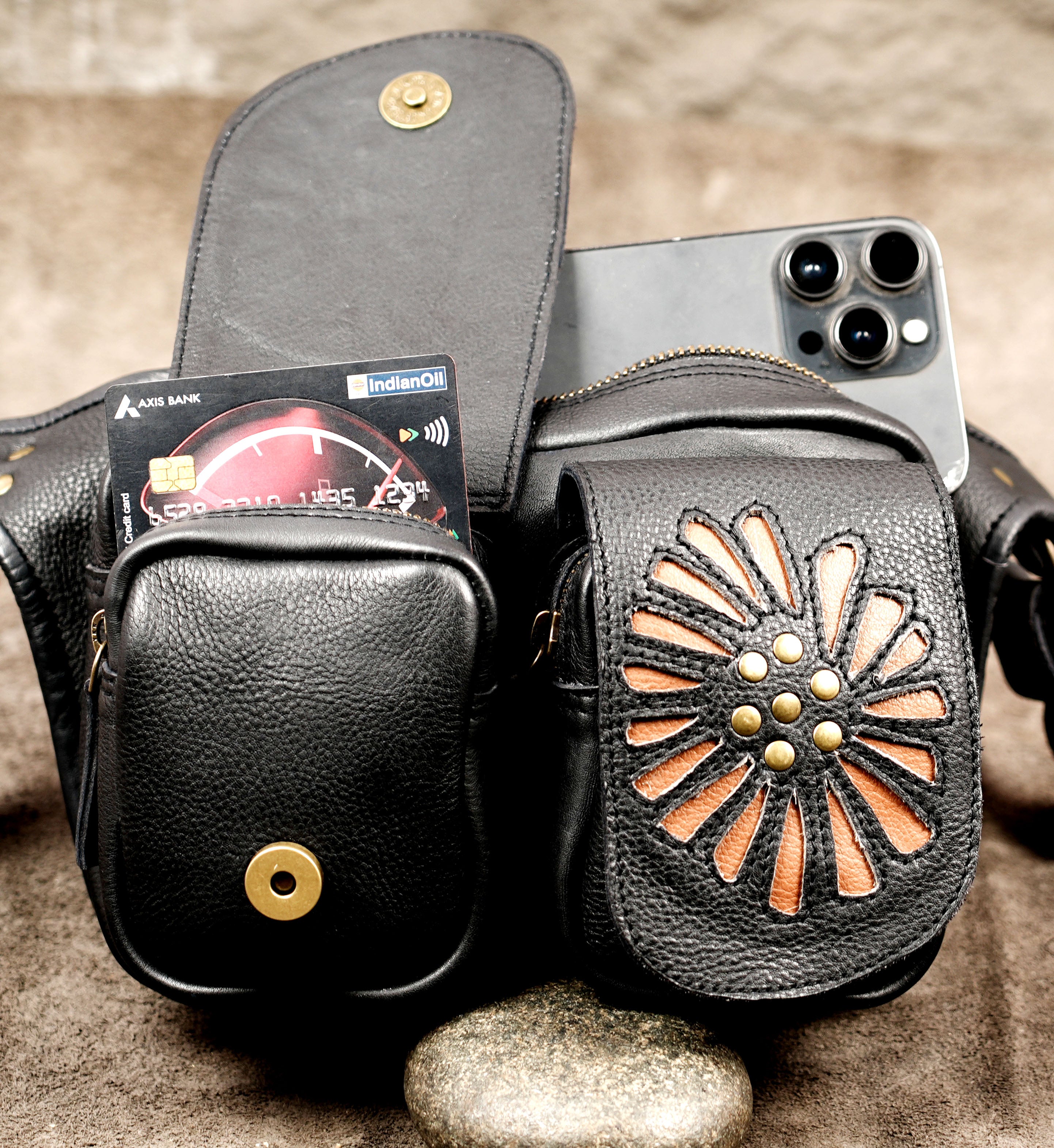 Boho leather pocket belt with adjustable sizing and antique brass metal fittings.