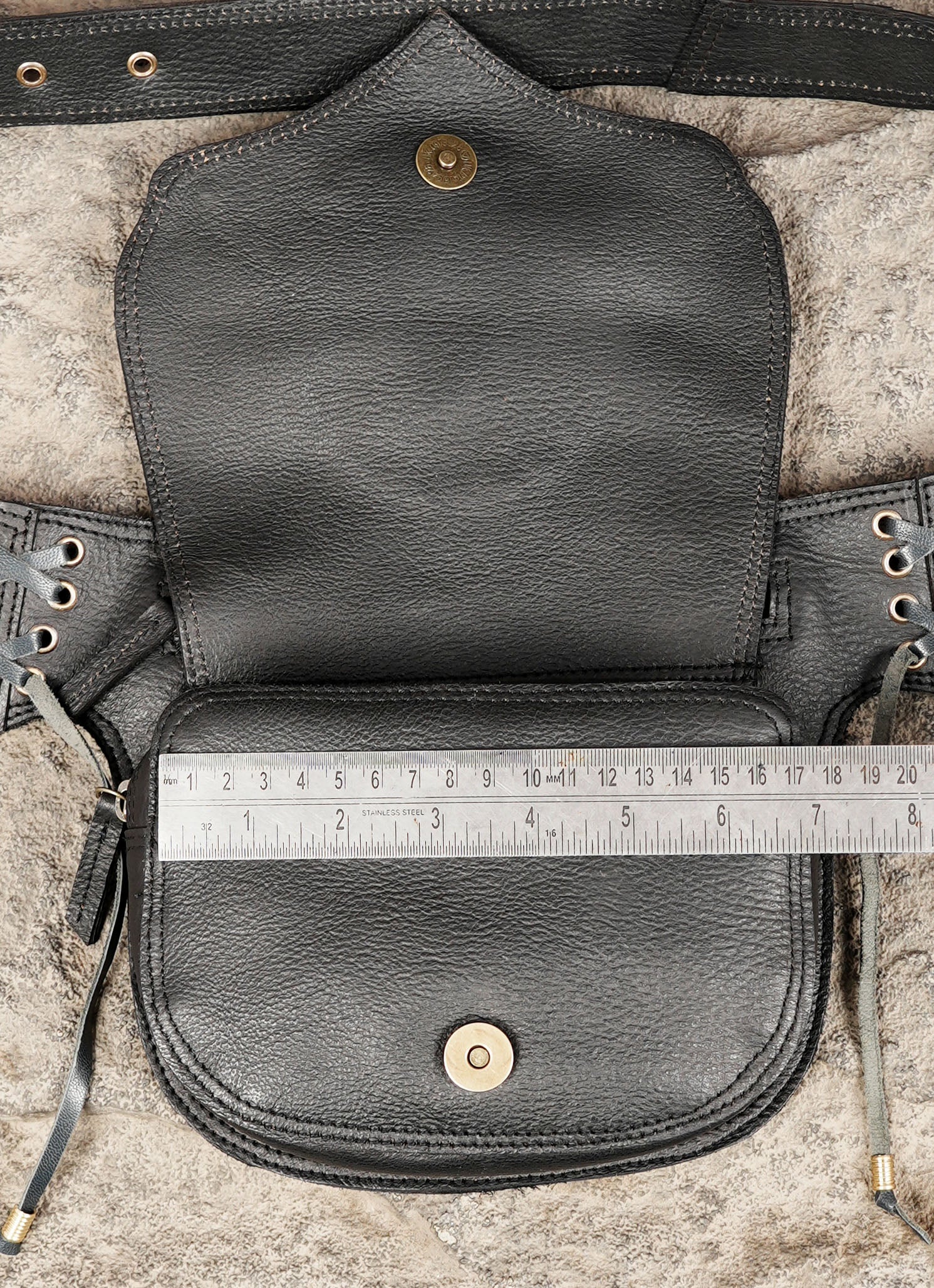 Unisex black leather belt bag featuring labradorite gemstone and handcrafted decorative details.