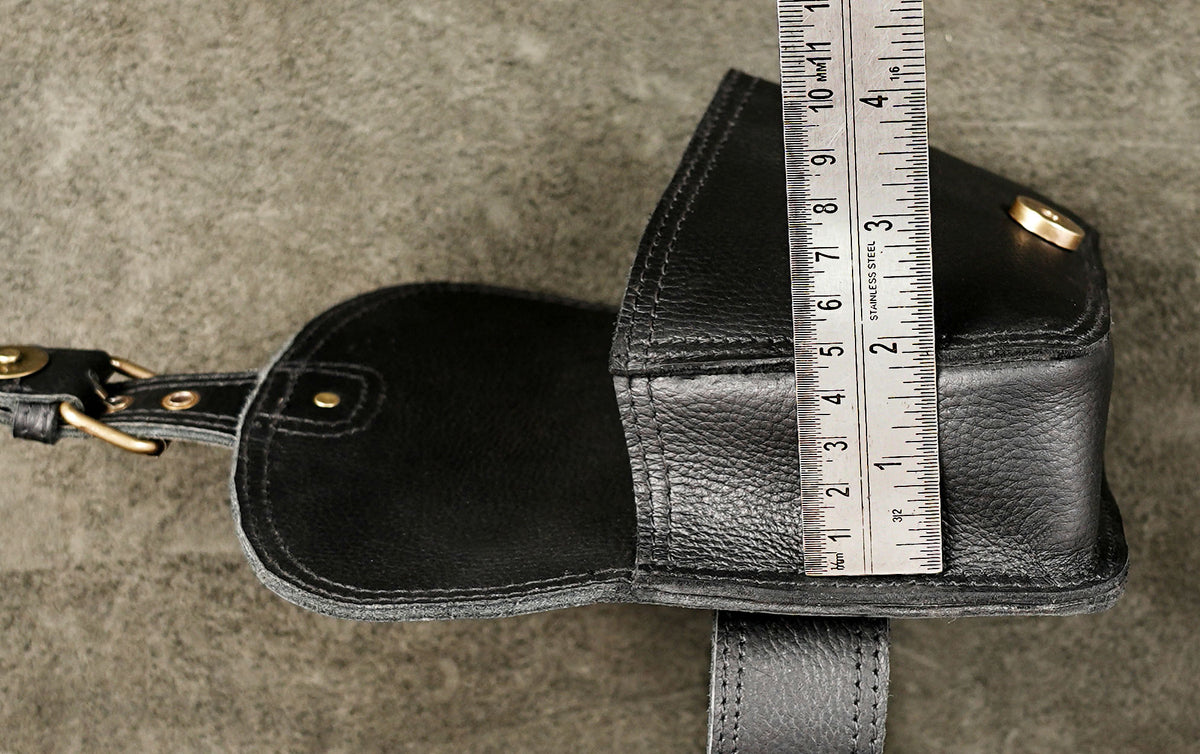 Black textured leather hands-free waist bag with adjustable leather belt