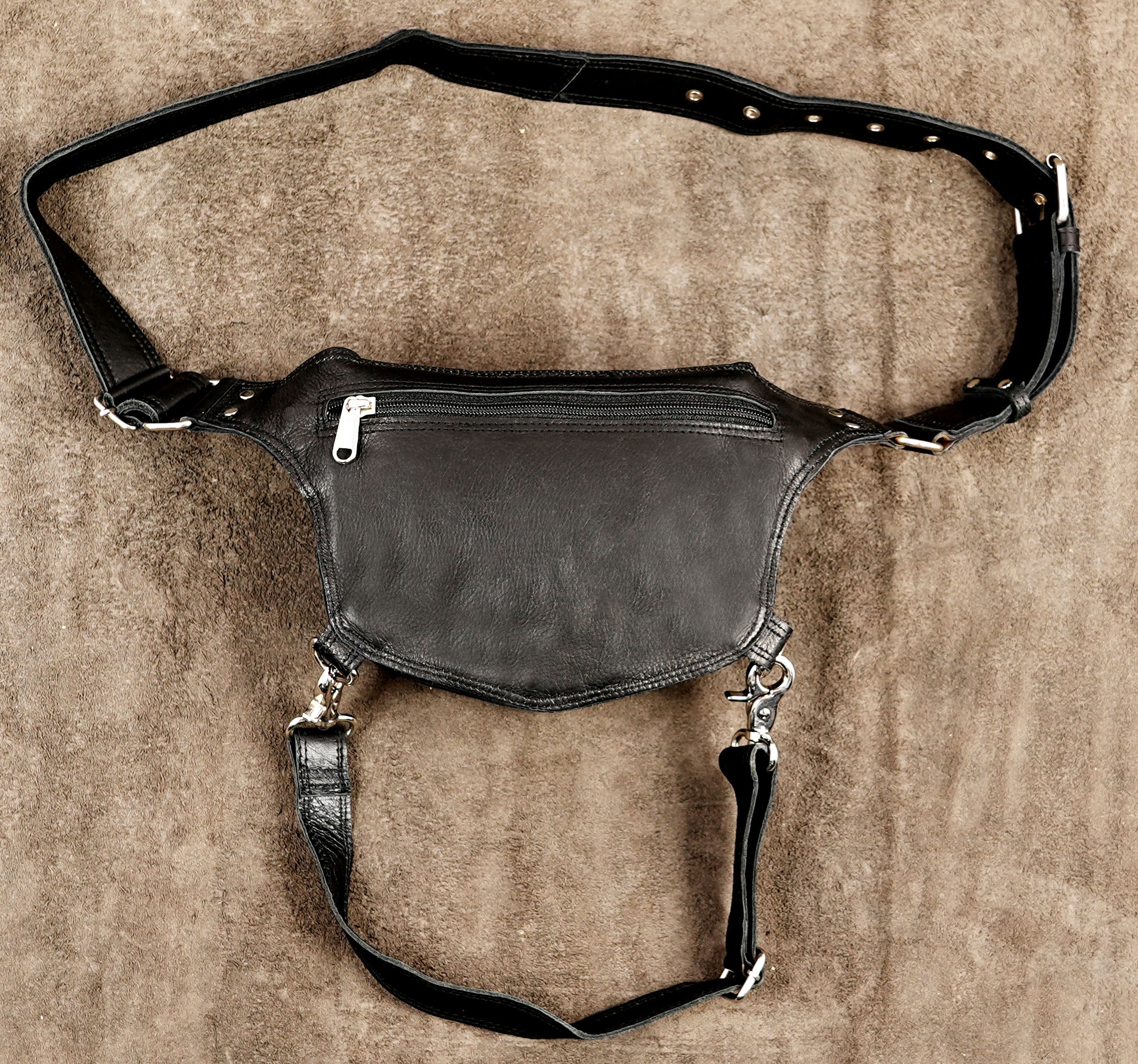 Versatile waist and thigh leather bag optimized for comfortable all-day use while traveling