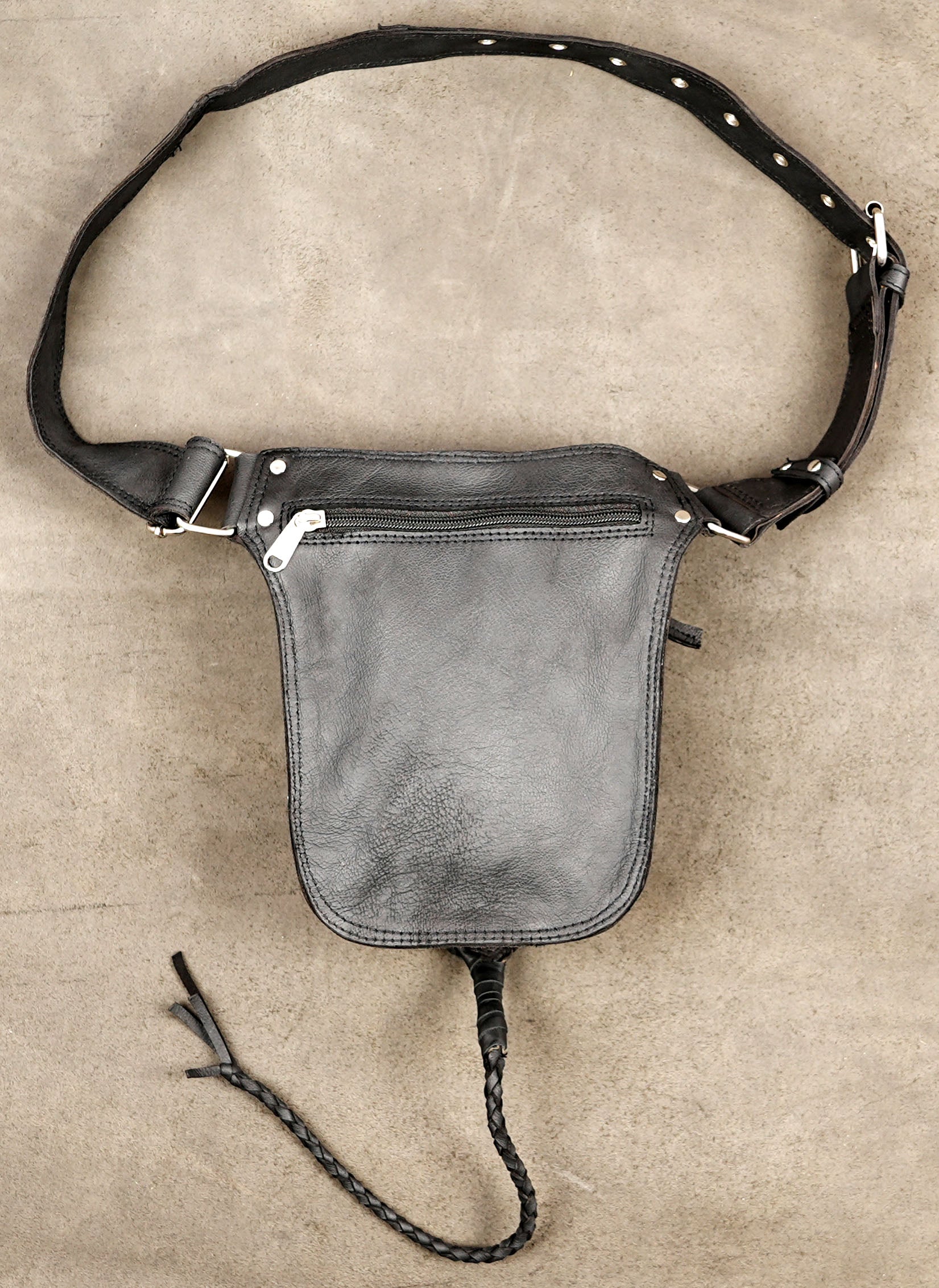 Adjustable leather belt bag with braided leather trim