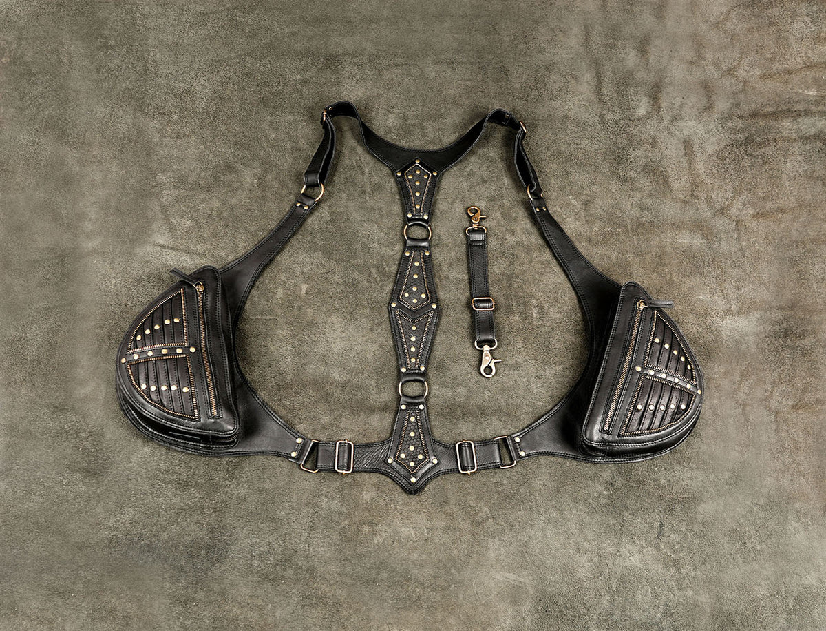 Black leather shoulder harness bag with studded side pockets