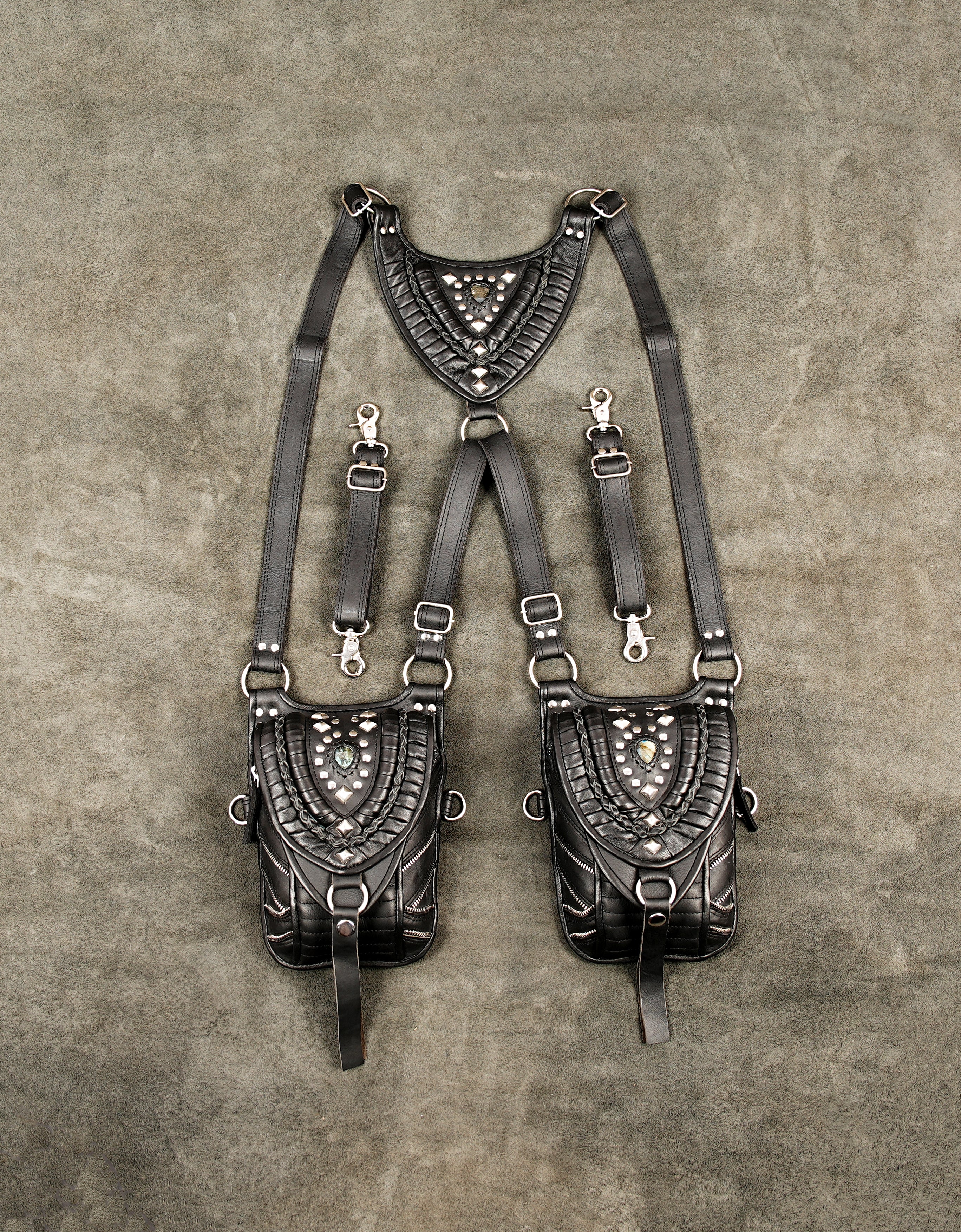 Black leather shoulder holster bag with studs and dual thigh pouches layout