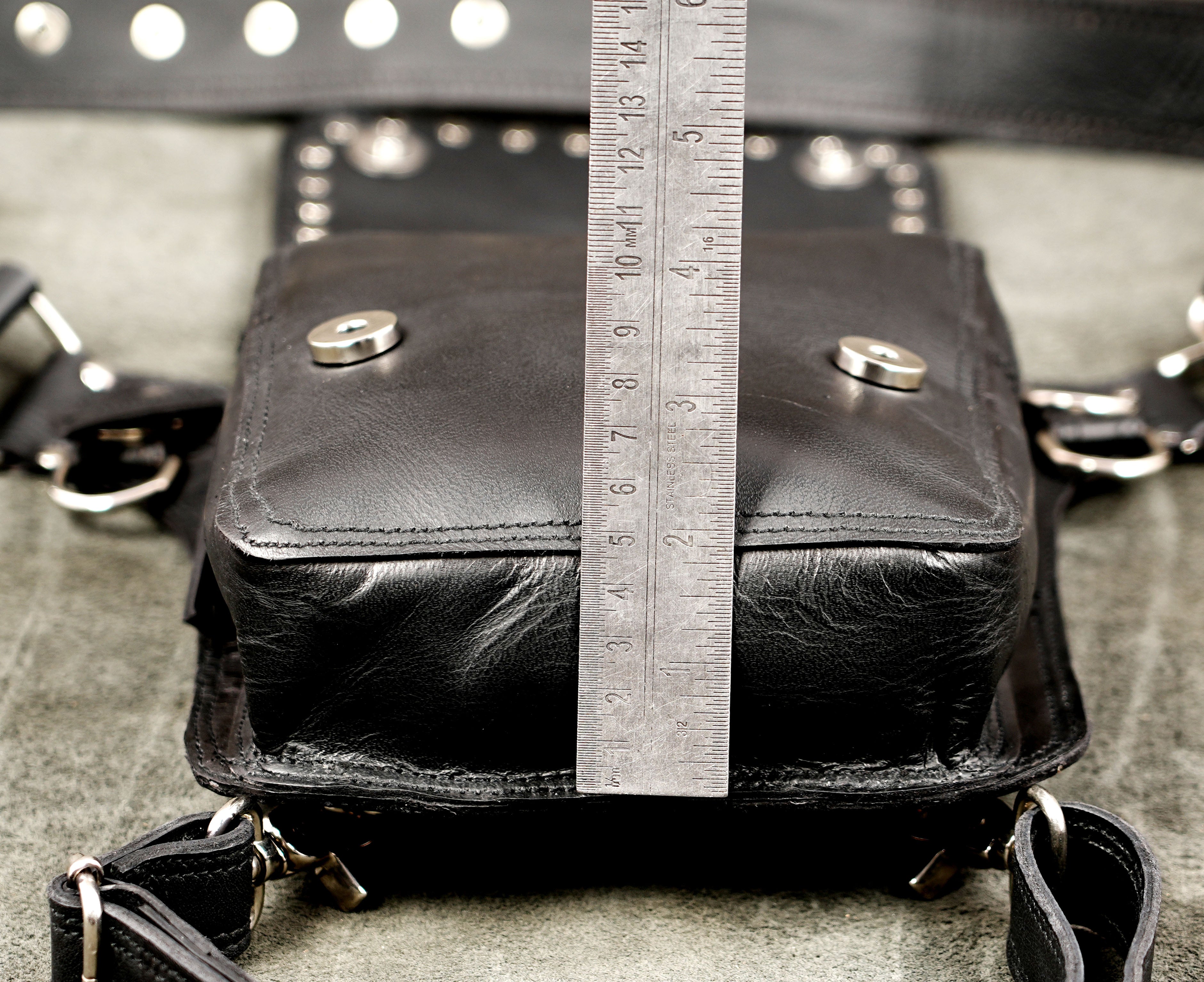 Alt fashion black leather leg harness bag with metal O-rings.