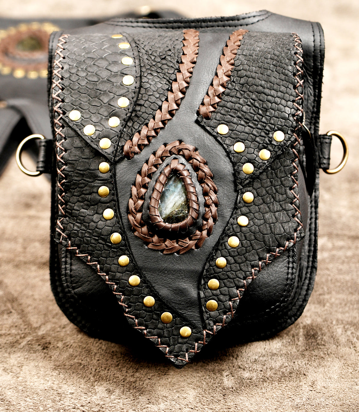 Handmade black leather shoulder holster with antique brass hardware