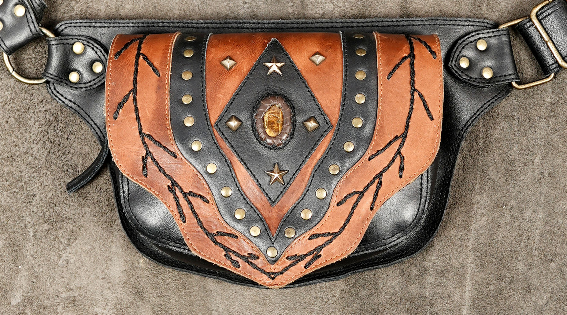 Boho western leather waist bag with hand-stitched braid design