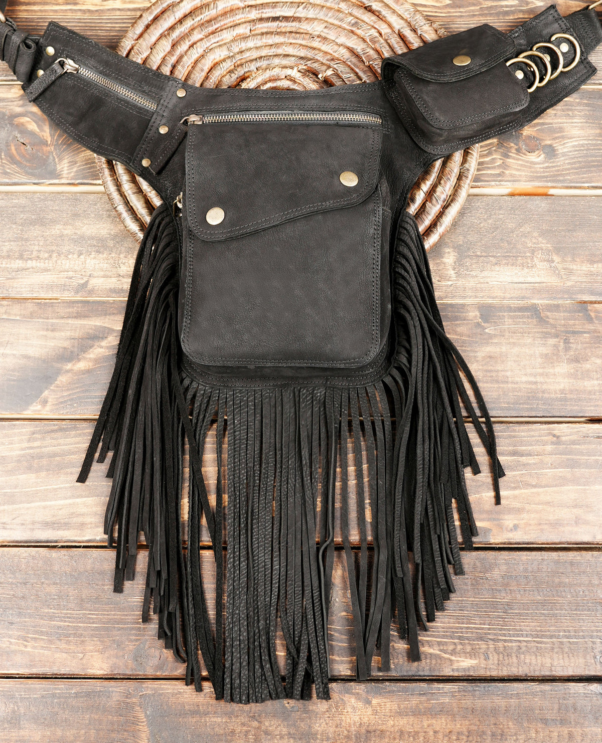 Unisex black leather fanny pack with long fringe tassels