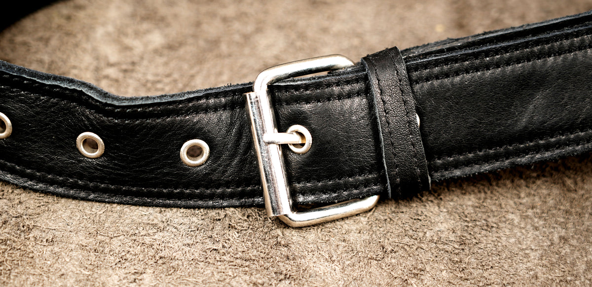 black leather waist-to-thigh bag with secure compartments for cards, keys, and phone essentials