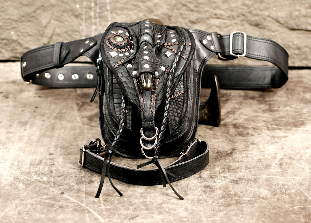 Edgy black leather hip pouch with adjustable straps and metal hardware