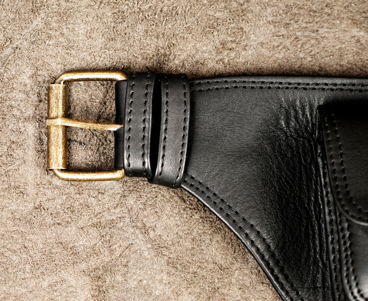 Heavy-duty black leather waist pack with multiple storage pockets