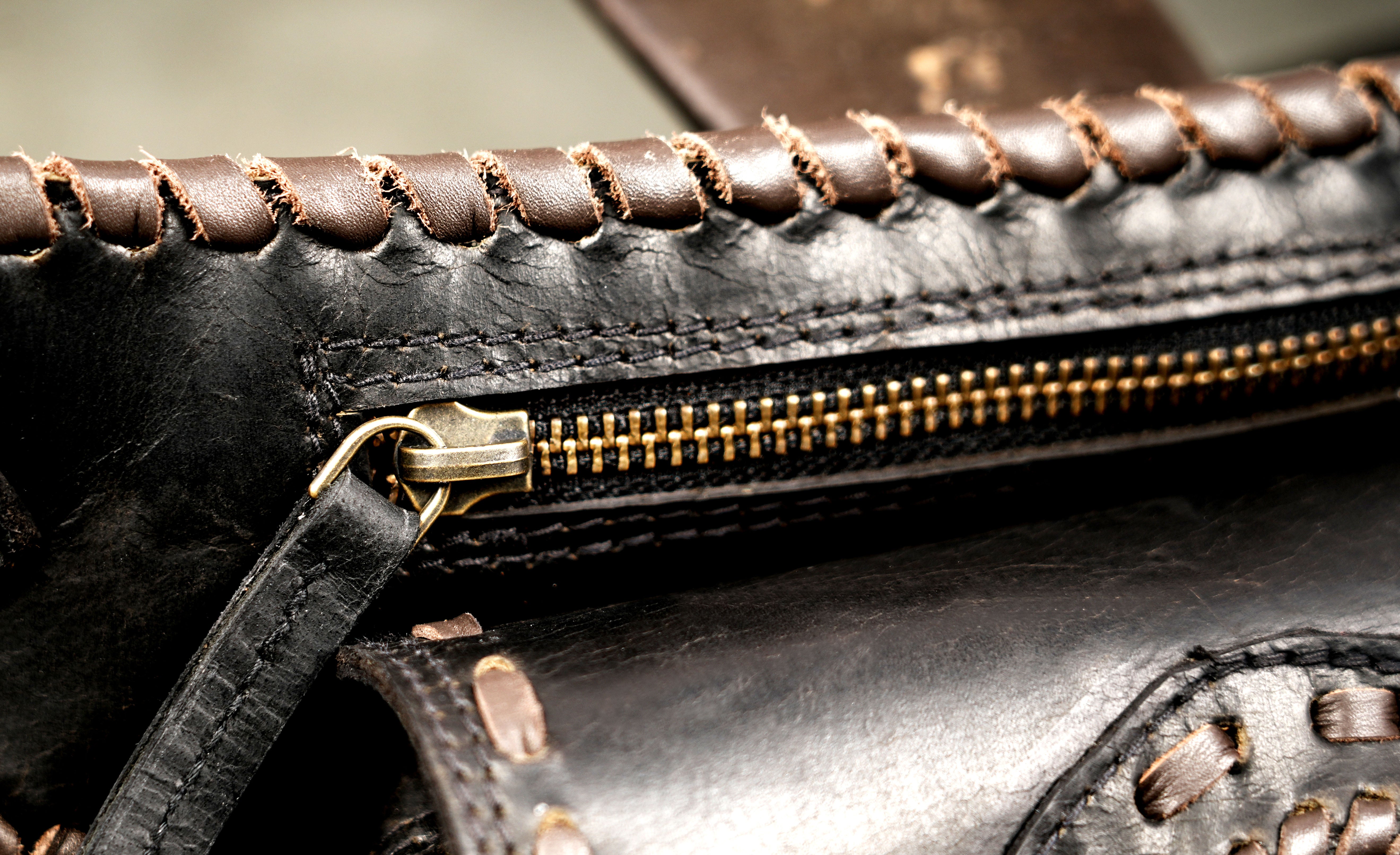 Leather waist pouch with decorative stitching