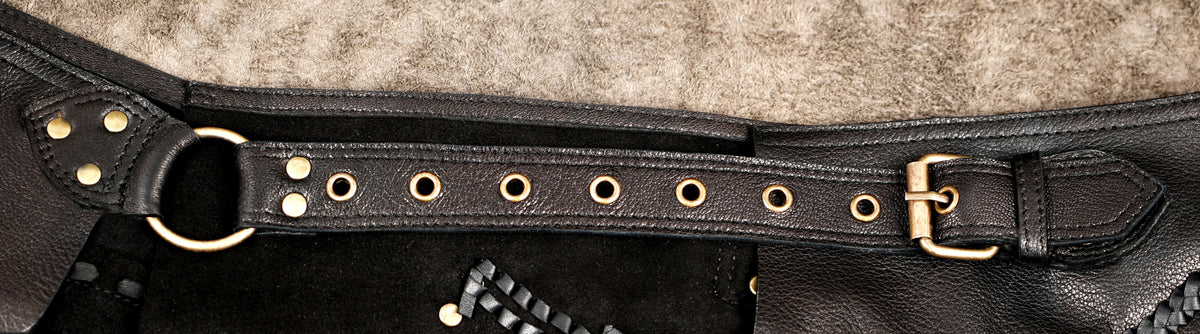 Leather rave skirt with handcrafted braided trim and metal accents