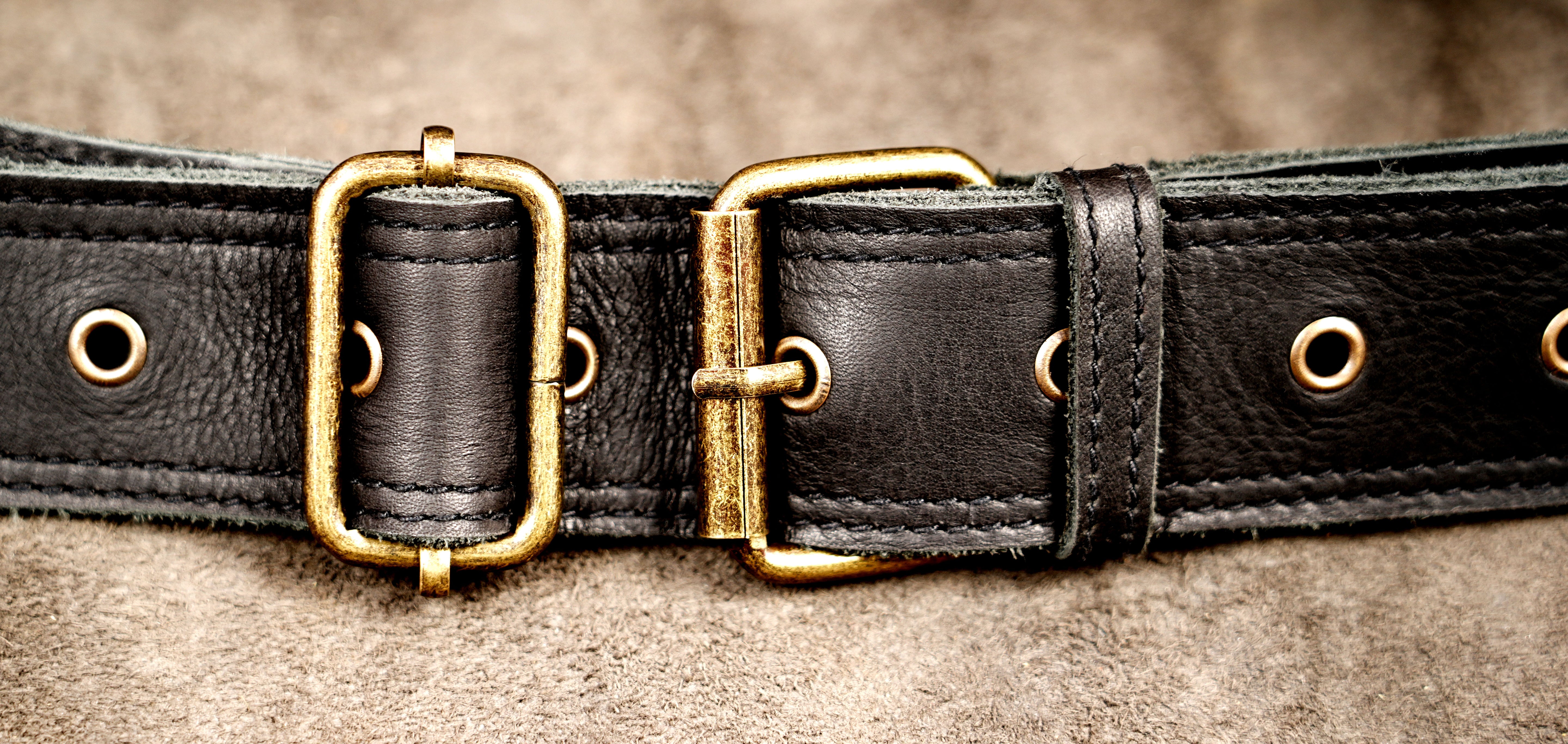 Adjustable leather hip belt with antique brass fittings