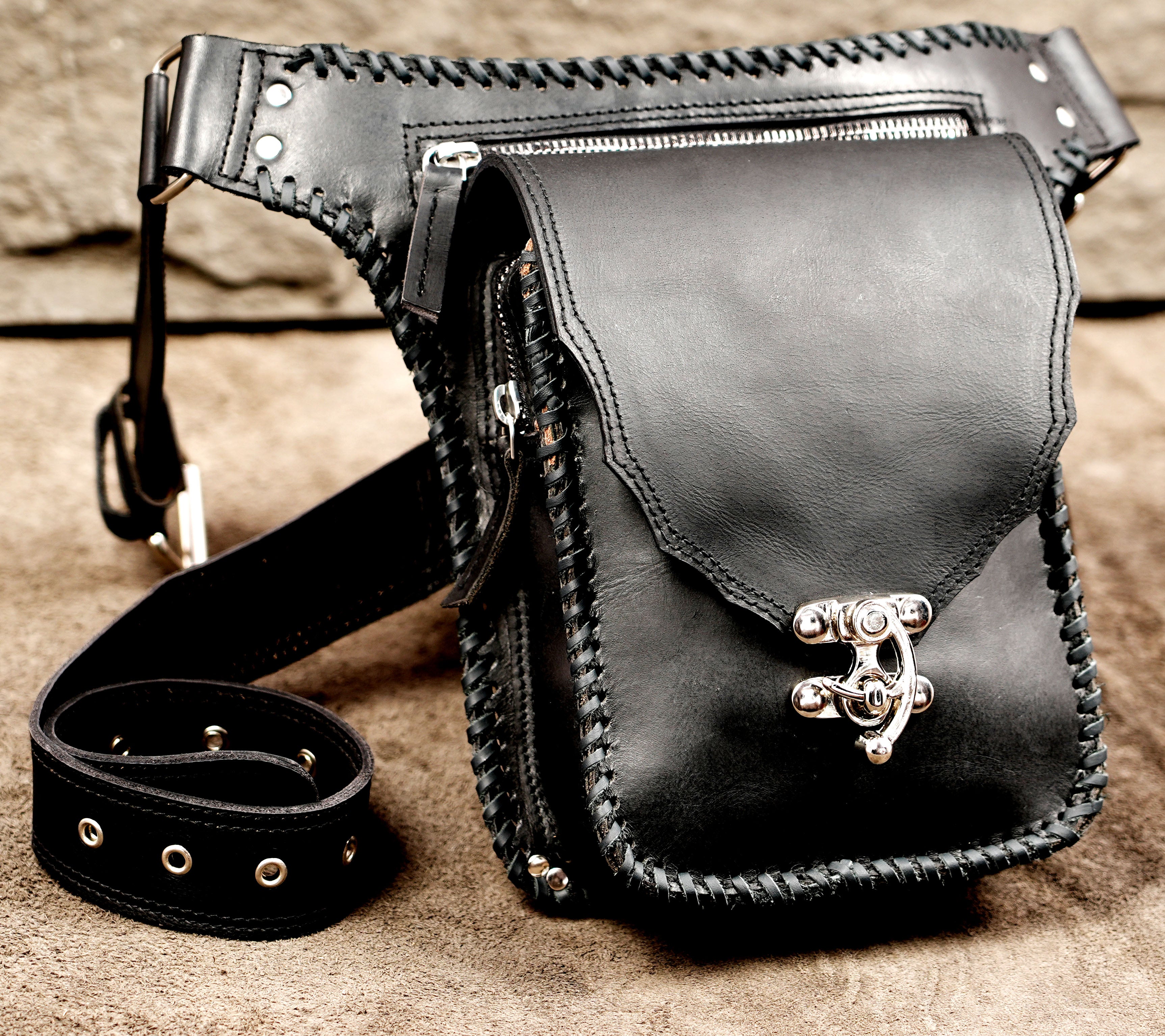 High-quality leather hip bag with intricate braided border work.