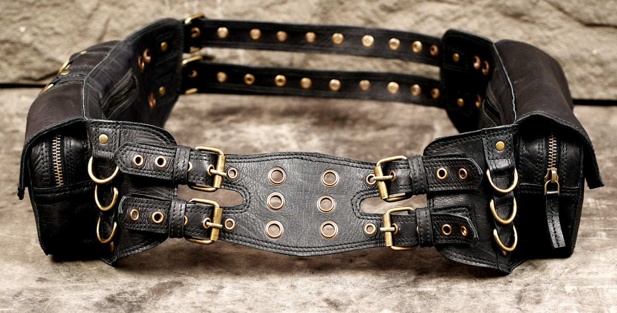 UNISEX black leather hip bag with multiple pockets and adjustable straps.