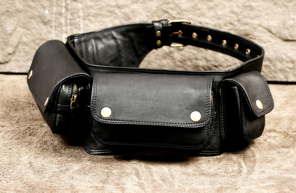 Black leather waist bag with brass hardware and cargo pockets