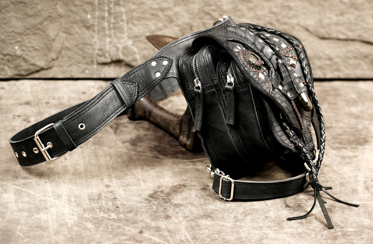 Unisex black leather hip belt bag with secure buckle closures