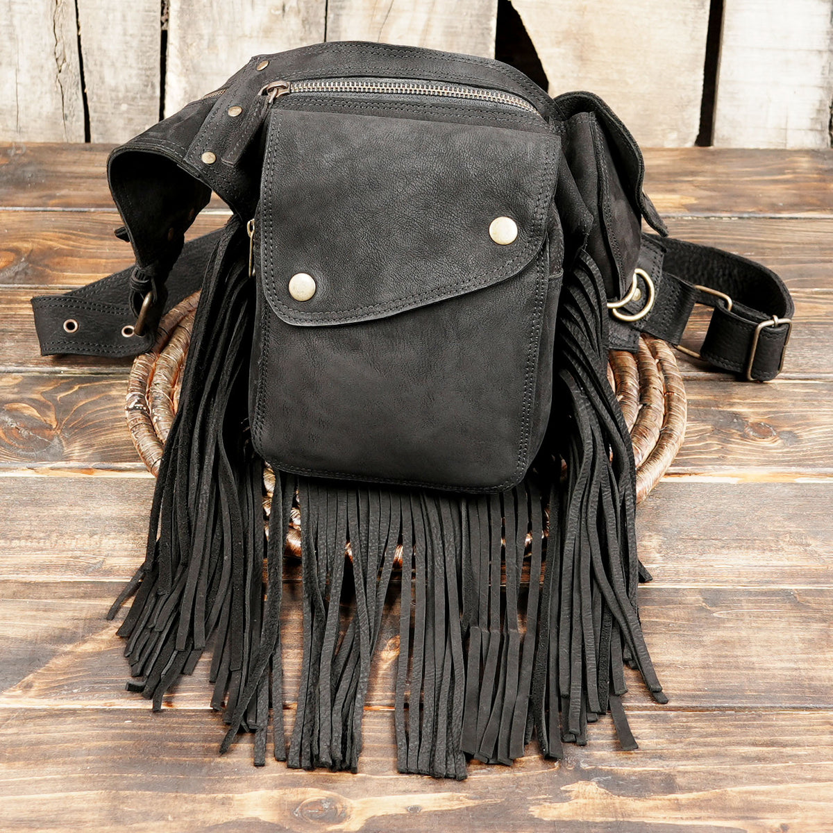 Leather boho hip pouch in black with fringe trim