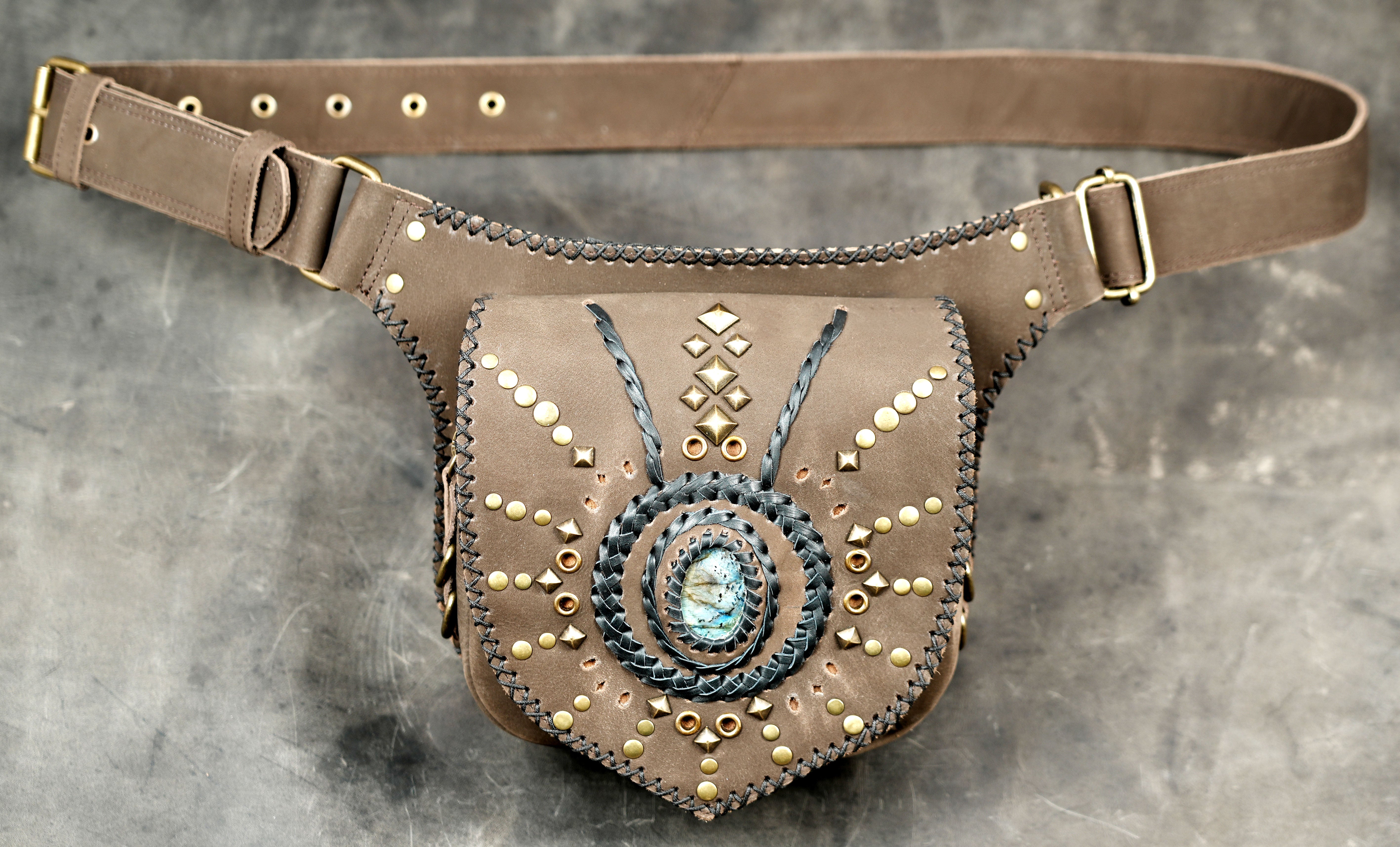 Leather crossbody hip bag with braided gemstone design