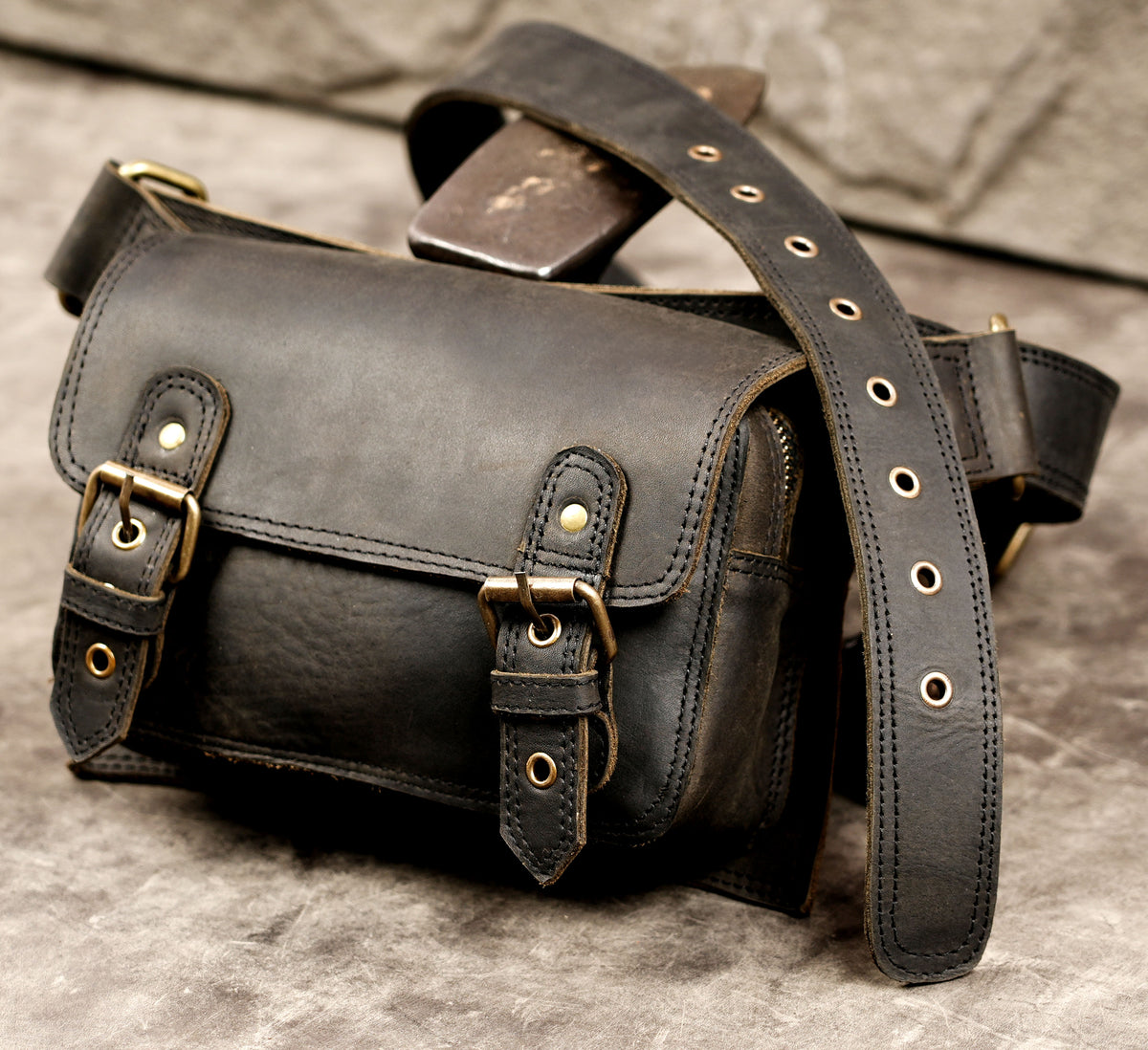 Rustic handmade leather hip strap with metal hardware