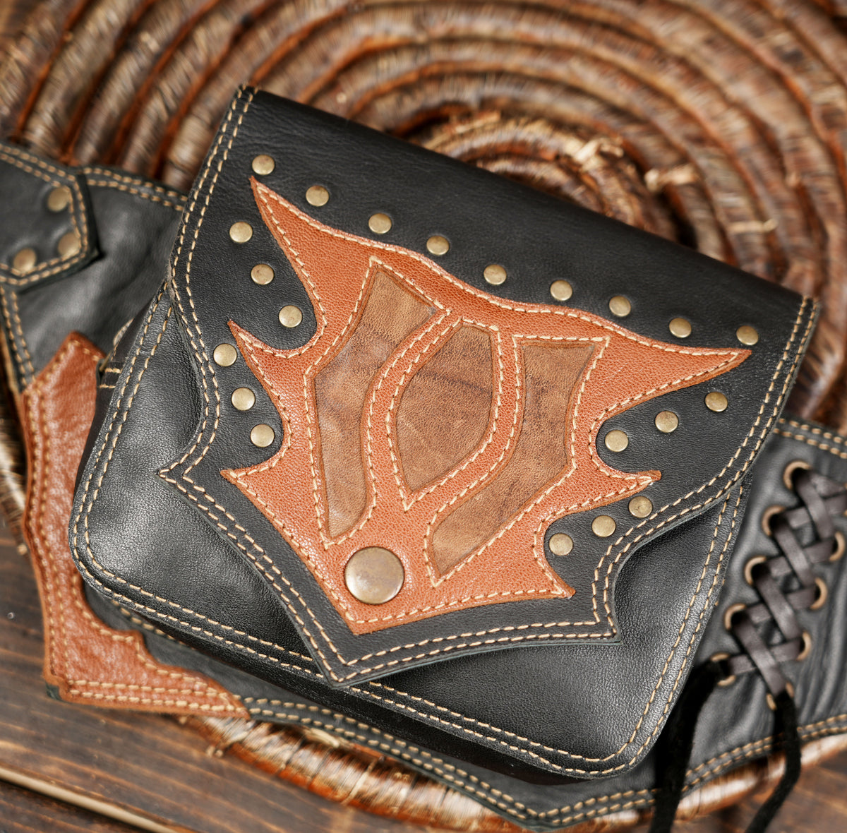 Black and brown leather waist bag with western style design for festivals and outdoor adventures