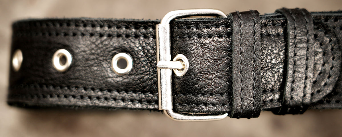 Adjustable black leather hip pack with lower thigh support strap
