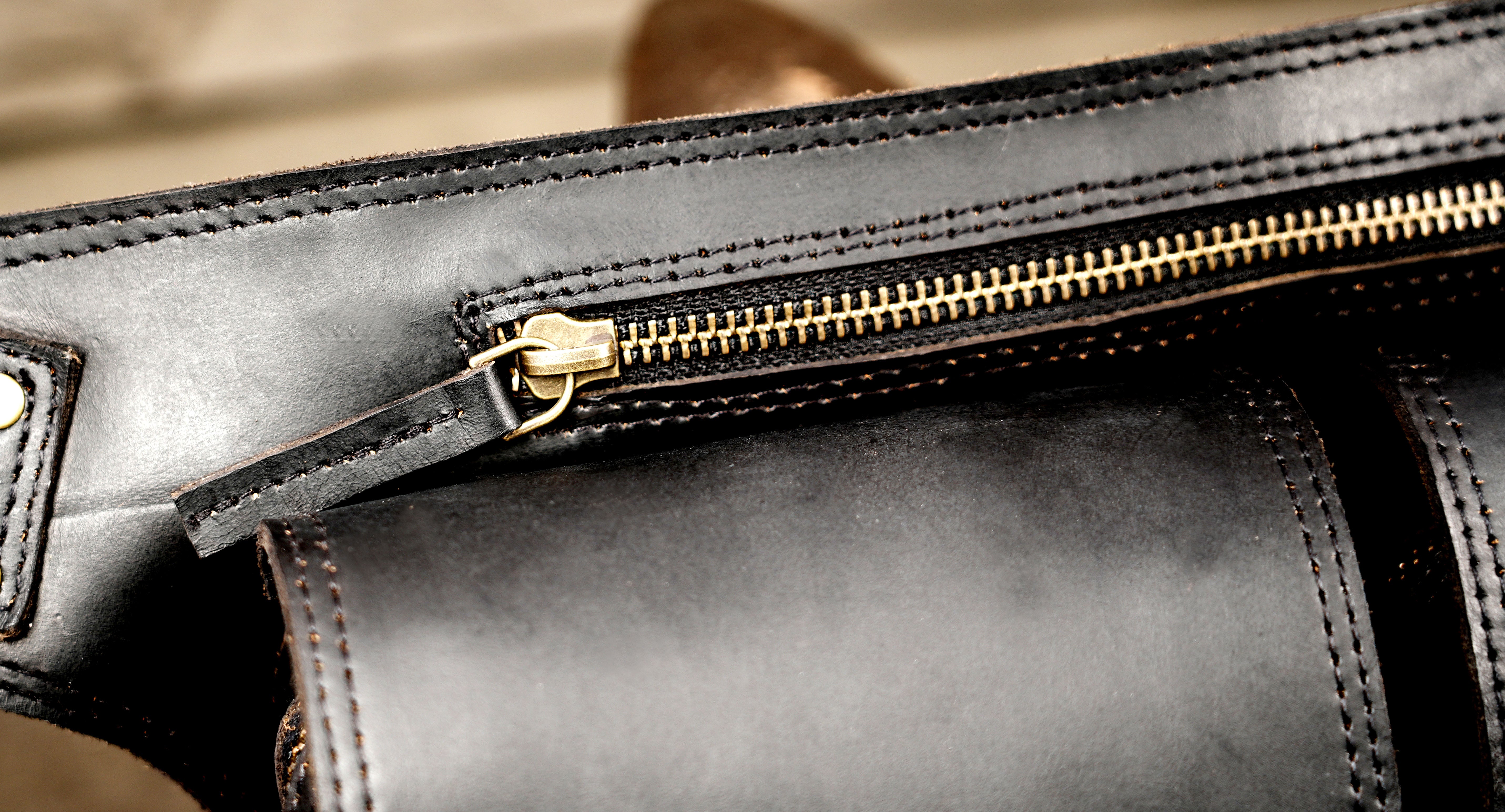 Adjustable leather hip bag with snap button pockets, flat lay