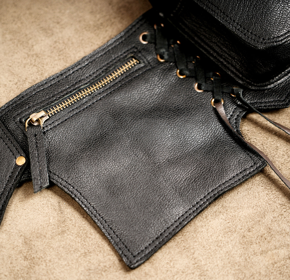 Adjustable leather hip belt with brass buckle and pouches