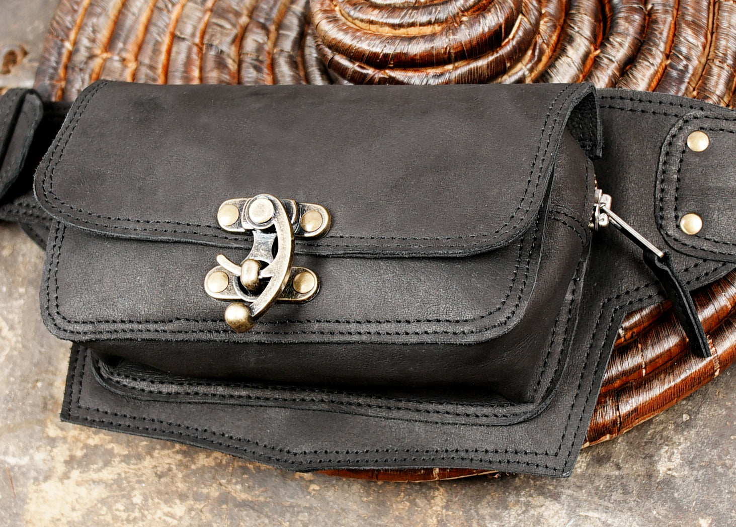 Adjustable leather hip belt with brass grommets and buckle