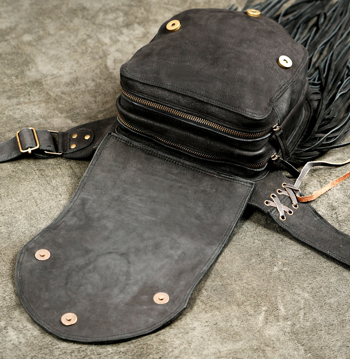 Adjustable leather hip belt with laced strap