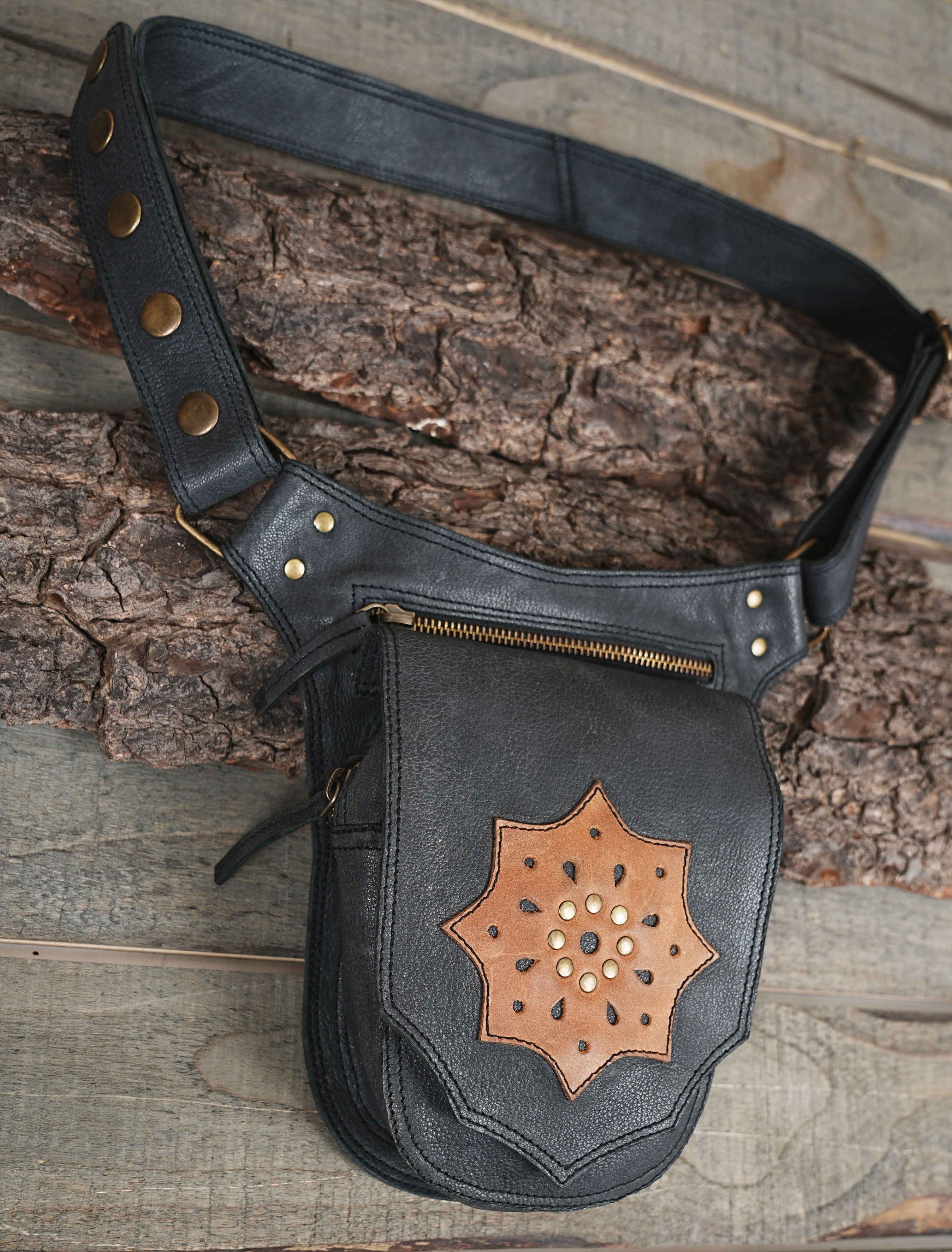 Adjustable leather waist bag with brass rivets and zipper closure