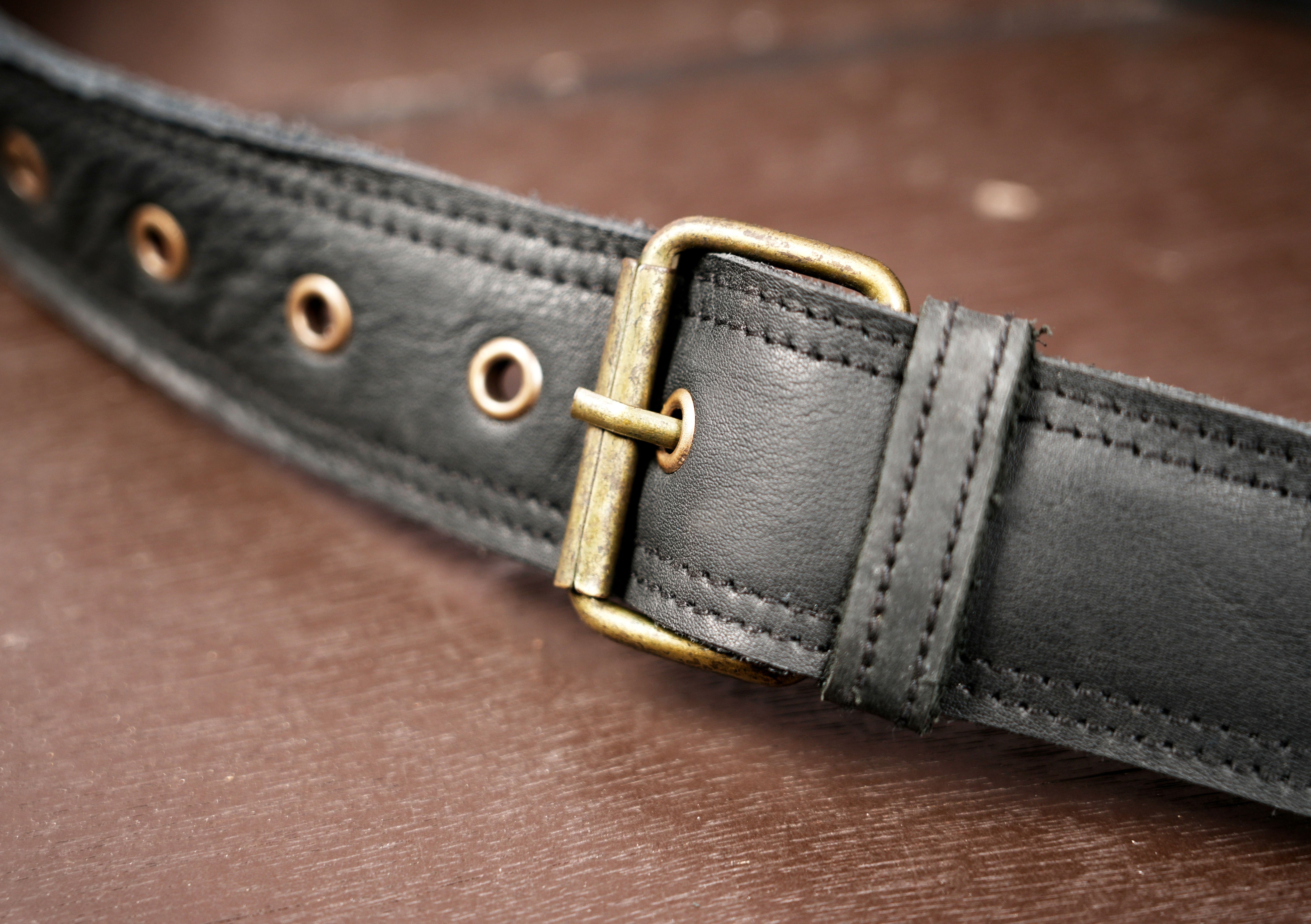 Adjustable leather waist belt with fringe and gemstone flap