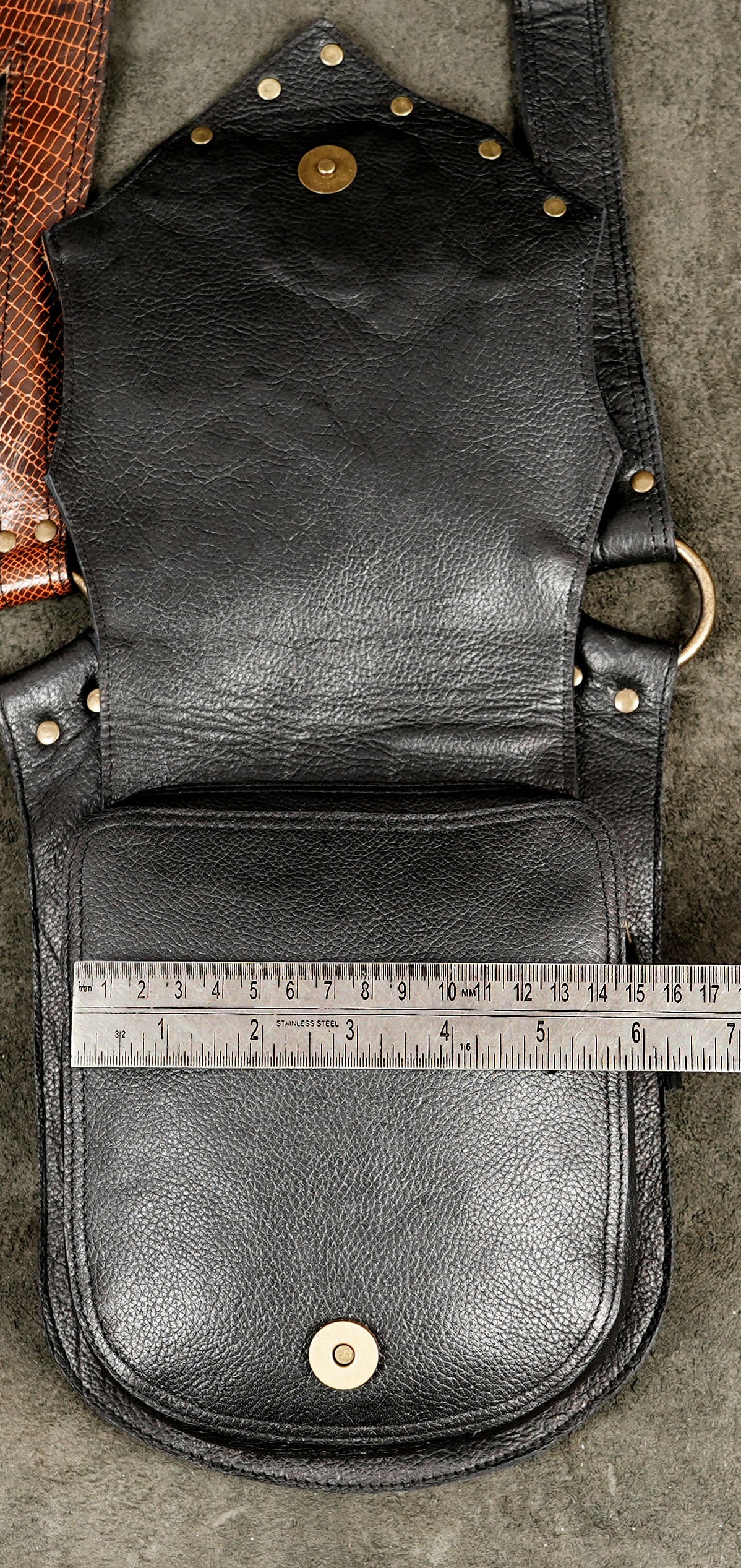 Adventure gear leather harness, hardware detail shot