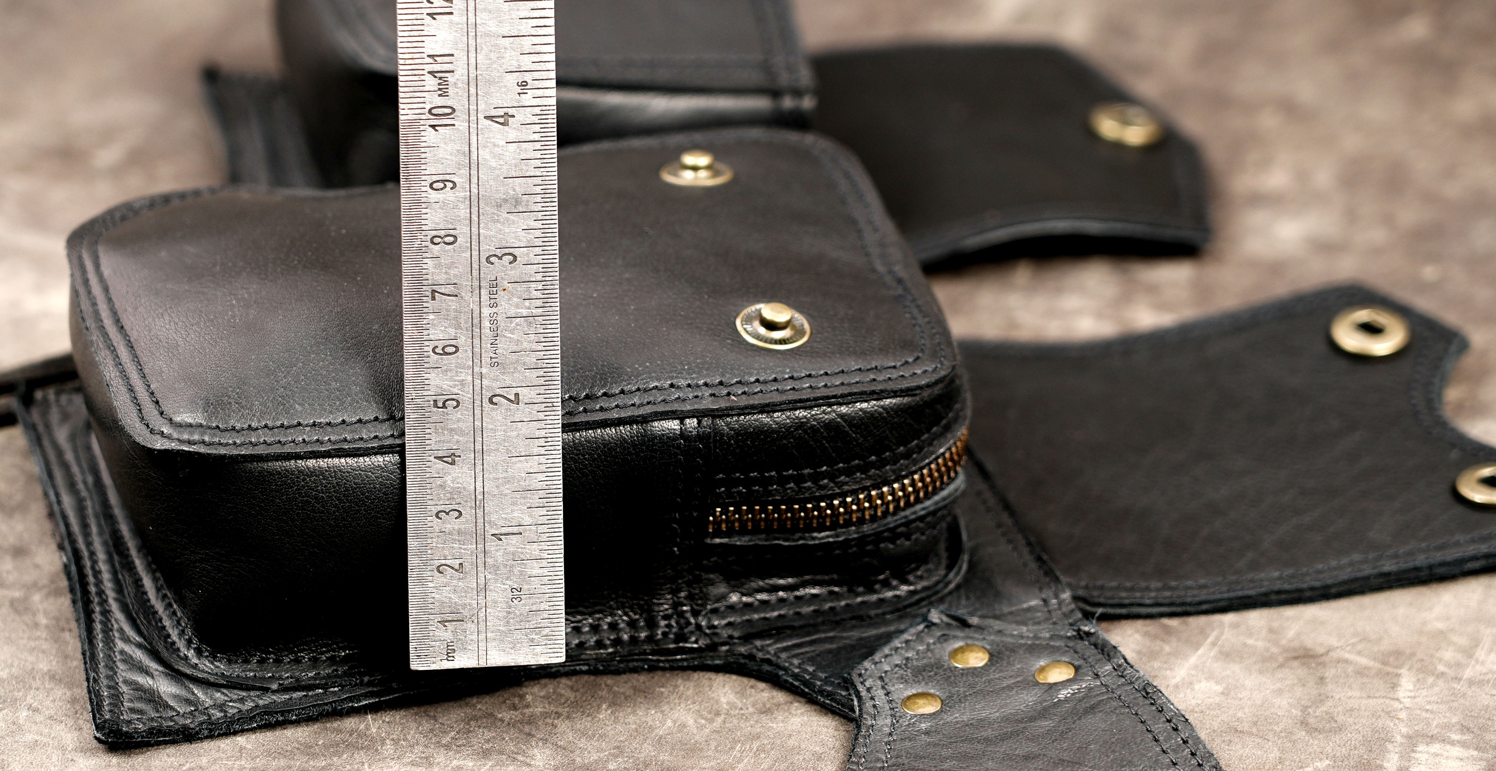 Alternative-style black leather multi-pocket waist bag