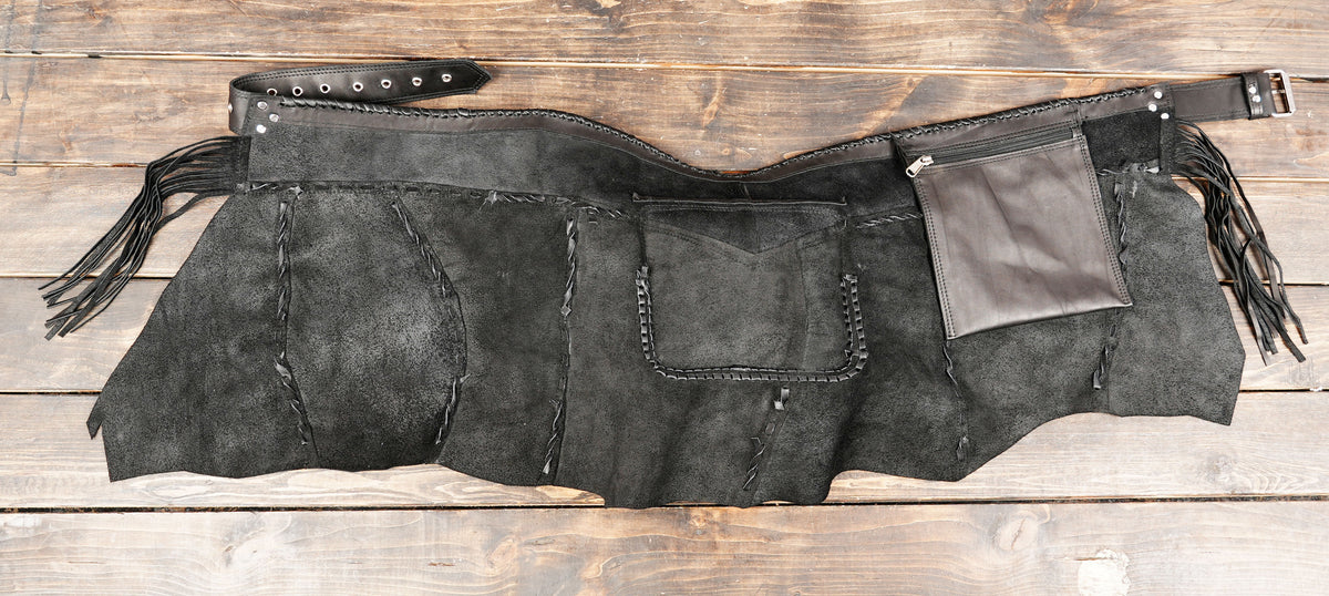 Artisan-made leather utility skirt with adjustable buckle
