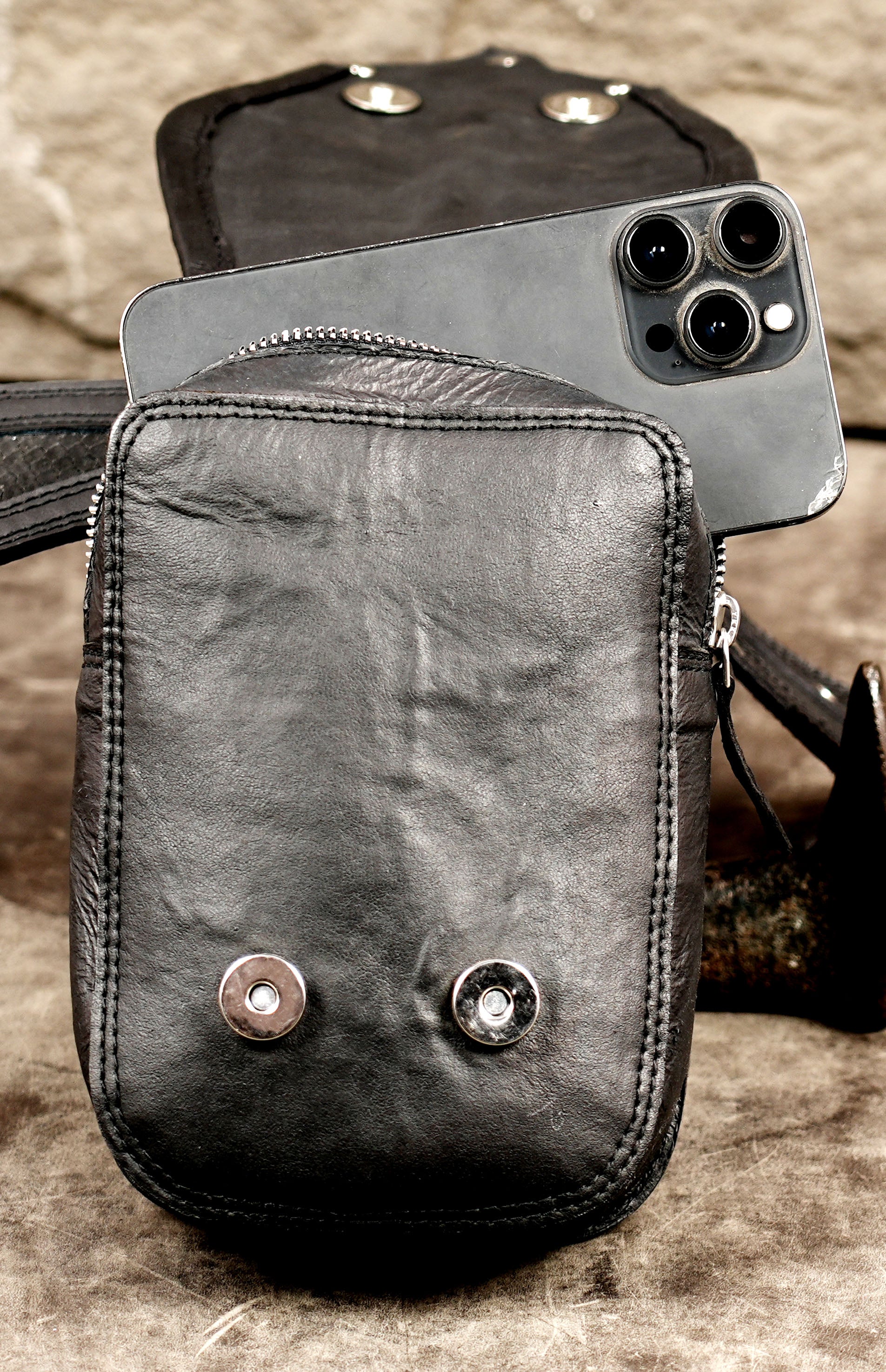 Artisan leather belt pouch with braided decoration